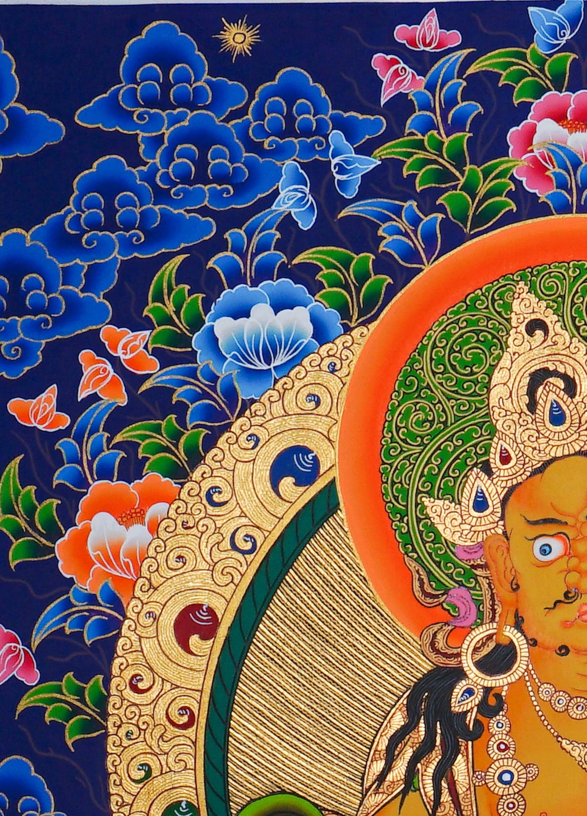 Hand painted Zambala Thangka painting depicting the Buddhist deity of prosperity seated on a lotus throne in traditional Nepalese Buddhist art