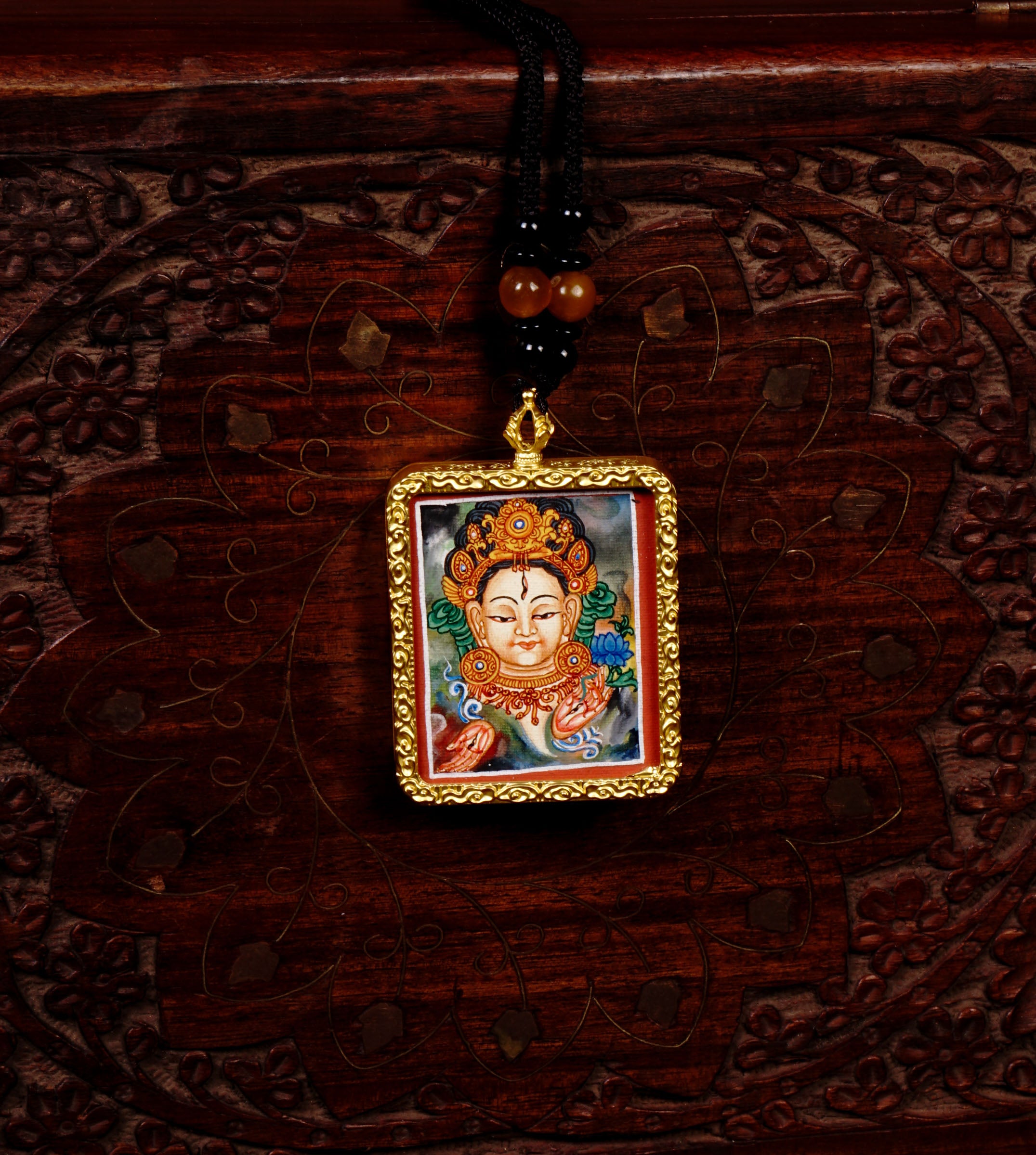 Hand-painted White Tara miniature Thangka pendant in gold-accented copper Ghau locket with black beaded cord.