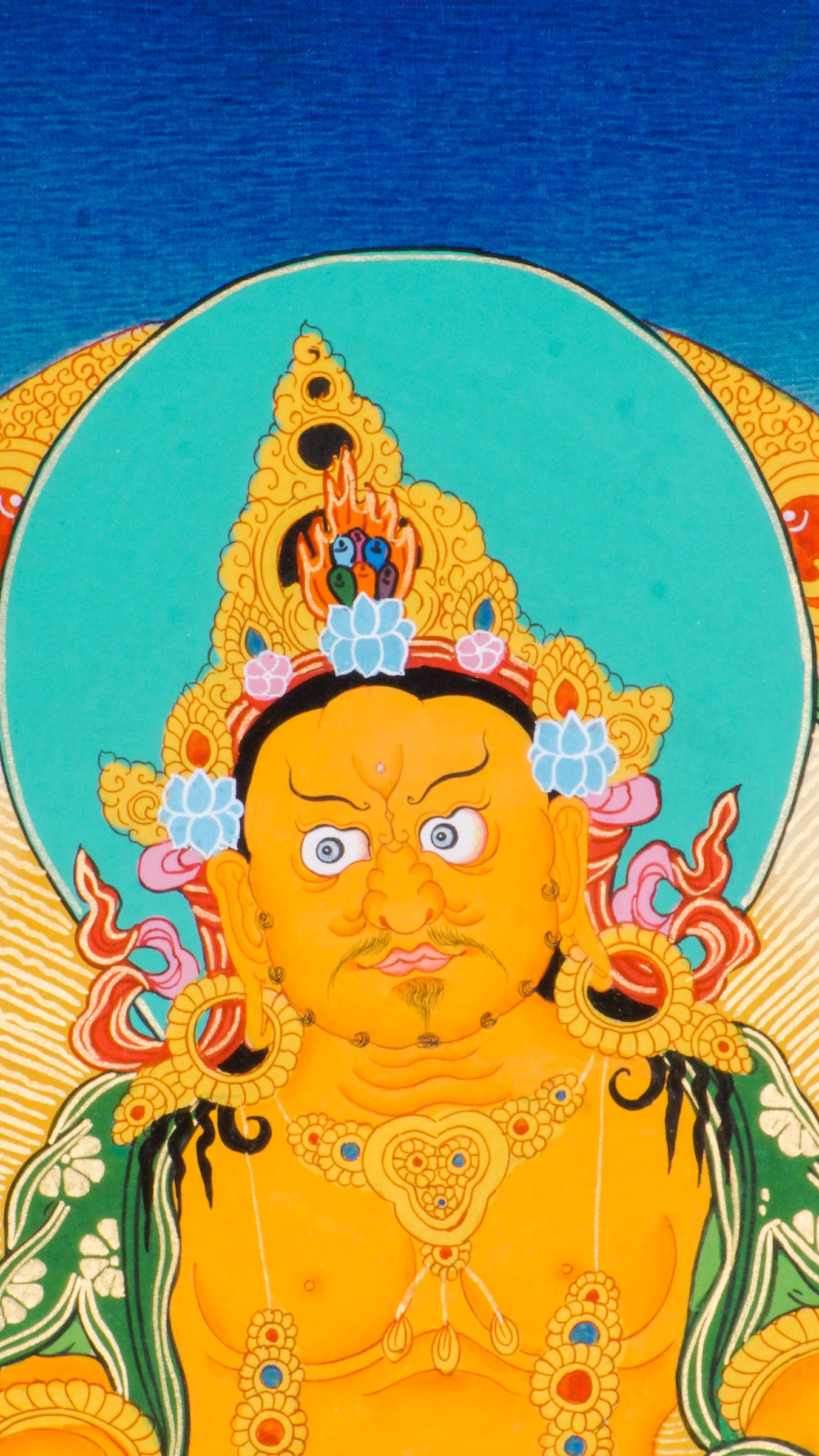 This is a hand-painted Thangka art showcasing wrathful deity Yellow Zambala in Nepal using 24k gold and natural pigments.