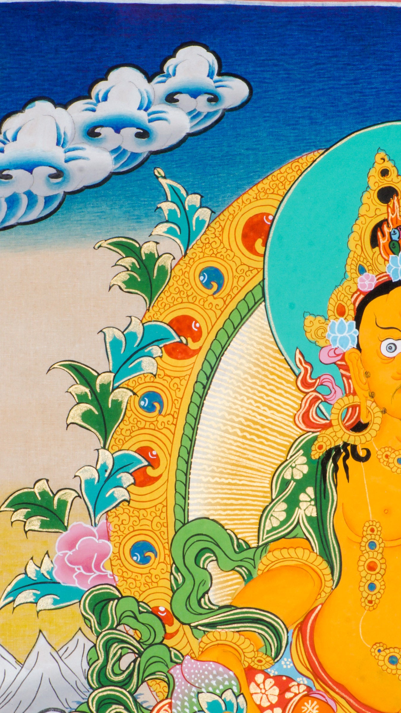 This is a hand-painted Thangka art showcasing wrathful deity Yellow Zambala in Nepal using 24k gold and natural pigments.