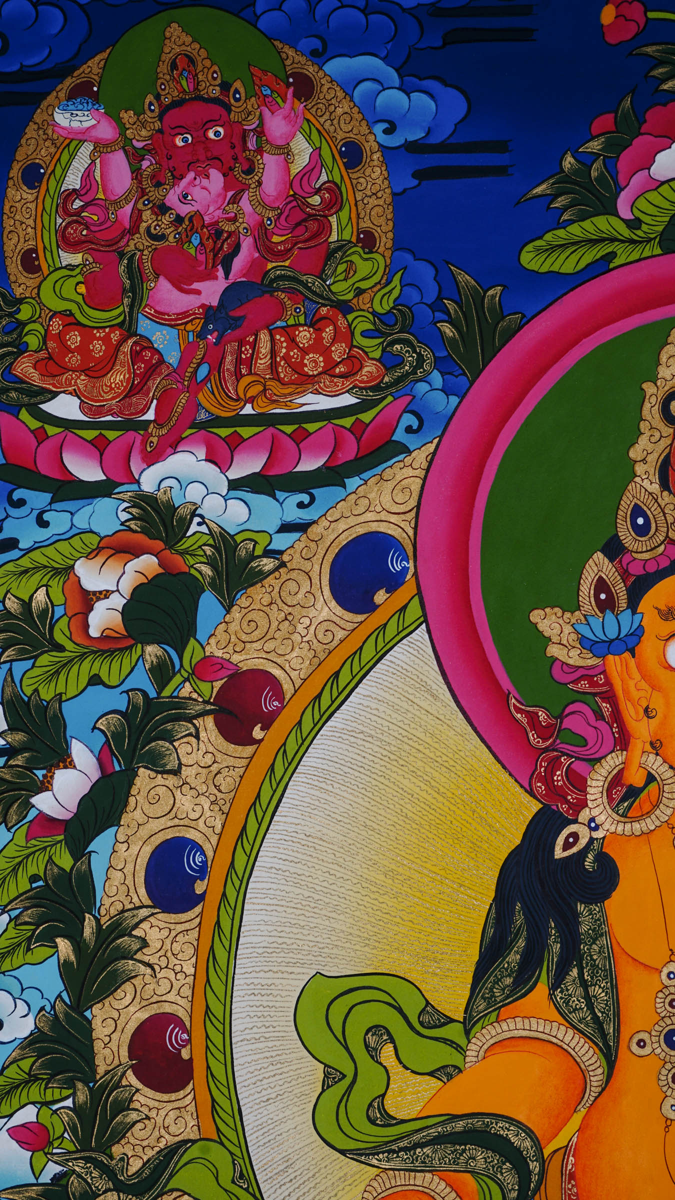Tibetan Buddhist thangka painting of Yellow Zambala (Jambhala), hand-painted in Nepal with natural mineral pigments and 24k gold, surrounded by four Zambala forms in each corner.