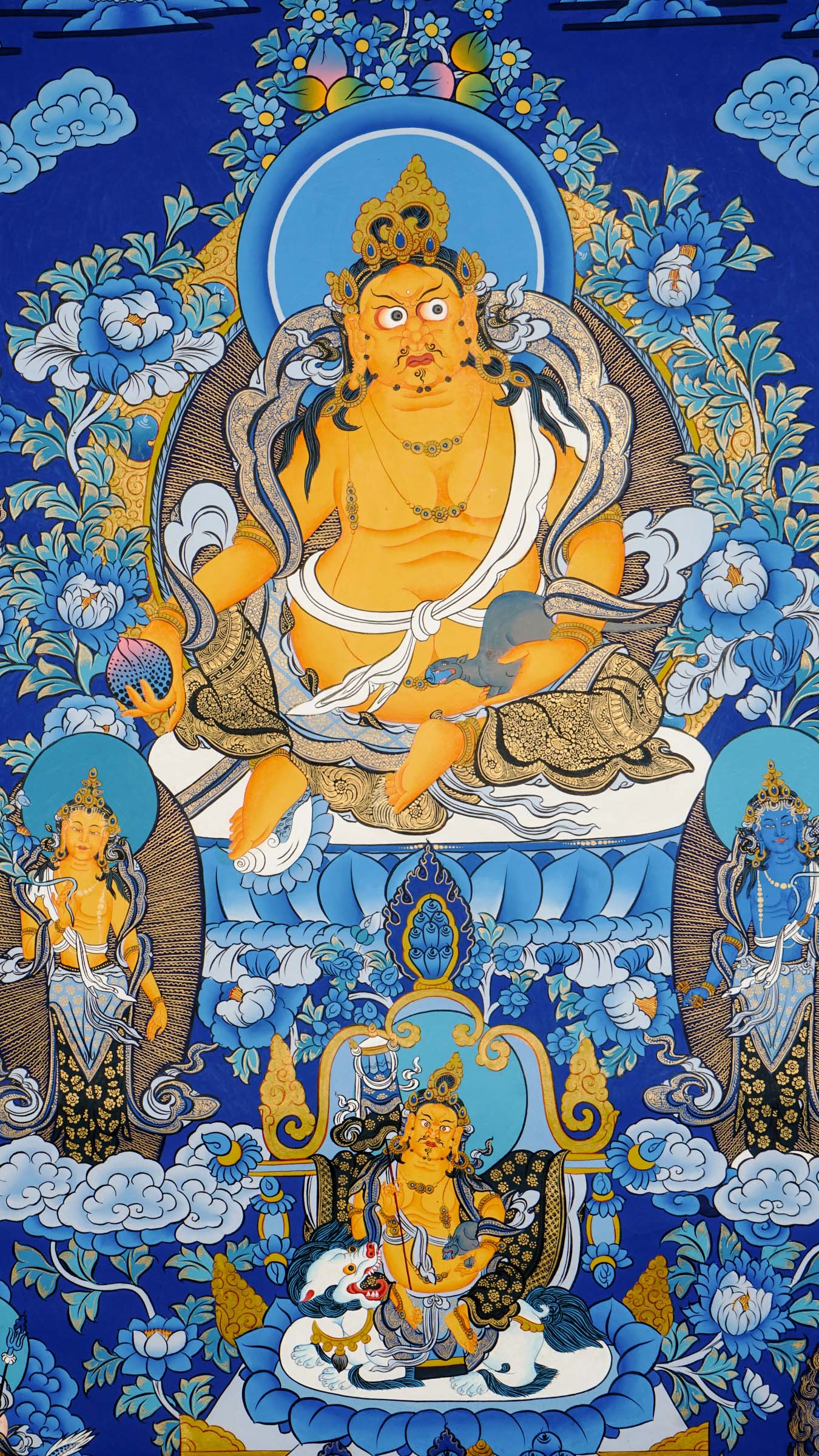 Tibetan thangka painting of Zambala, Buddhist god of wealth, handcrafted in Nepal with natural mineral pigments and 24k gold details, surrounded by deities and lotus motifs.