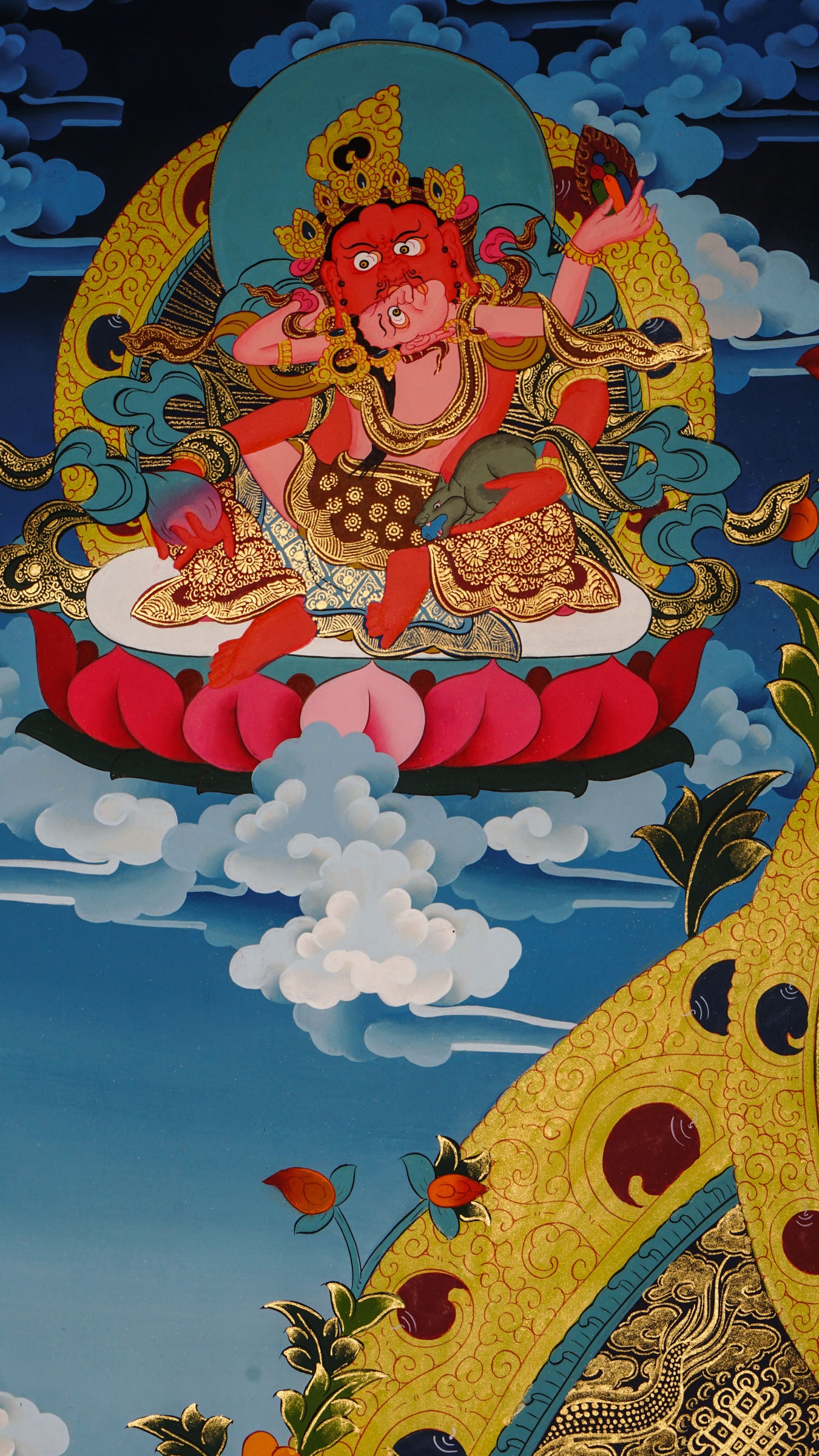 Zambala is a Tibetan Buddhist deity of wealth and prosperity. This genuine hand-painted thangka shows him holding a jewel-spouting mongoose and citron fruit, symbols of abundance and success. Made with natural mineral pigments on authentic canvas, this thangka attracts wealth, removes obstacles, and supports spiritual growth.