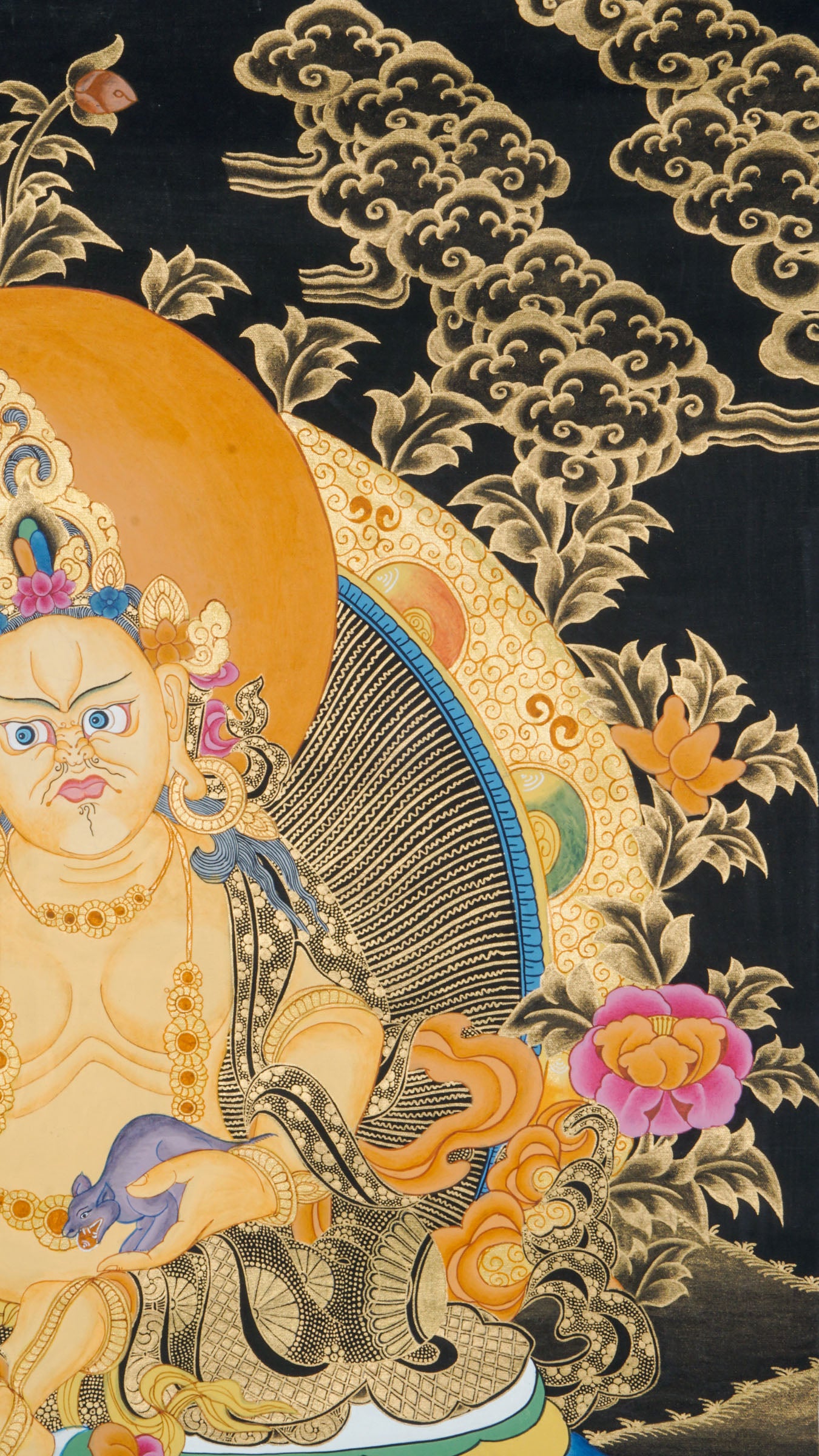 Zambala is a Tibetan Buddhist deity of wealth and prosperity. This genuine Thangka shows him seated on a lotus throne, holding a jewel-spouting mongoose and a symbol of fulfillment.
