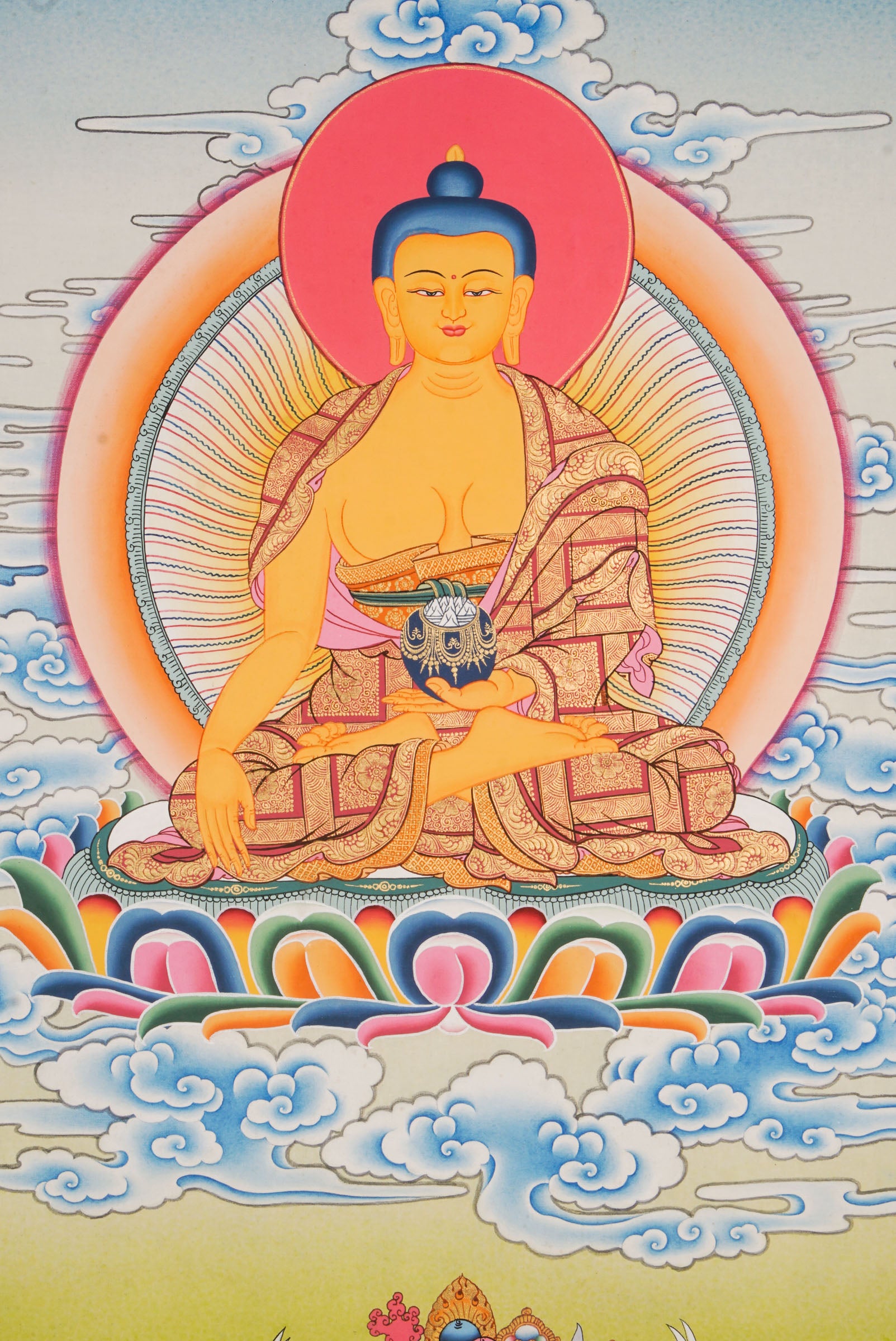 Using traditional techniques this hand-painted Shakyamuni Buddha Thangka is created by skilled Nepali artisans using 24k gold and natural pigments.