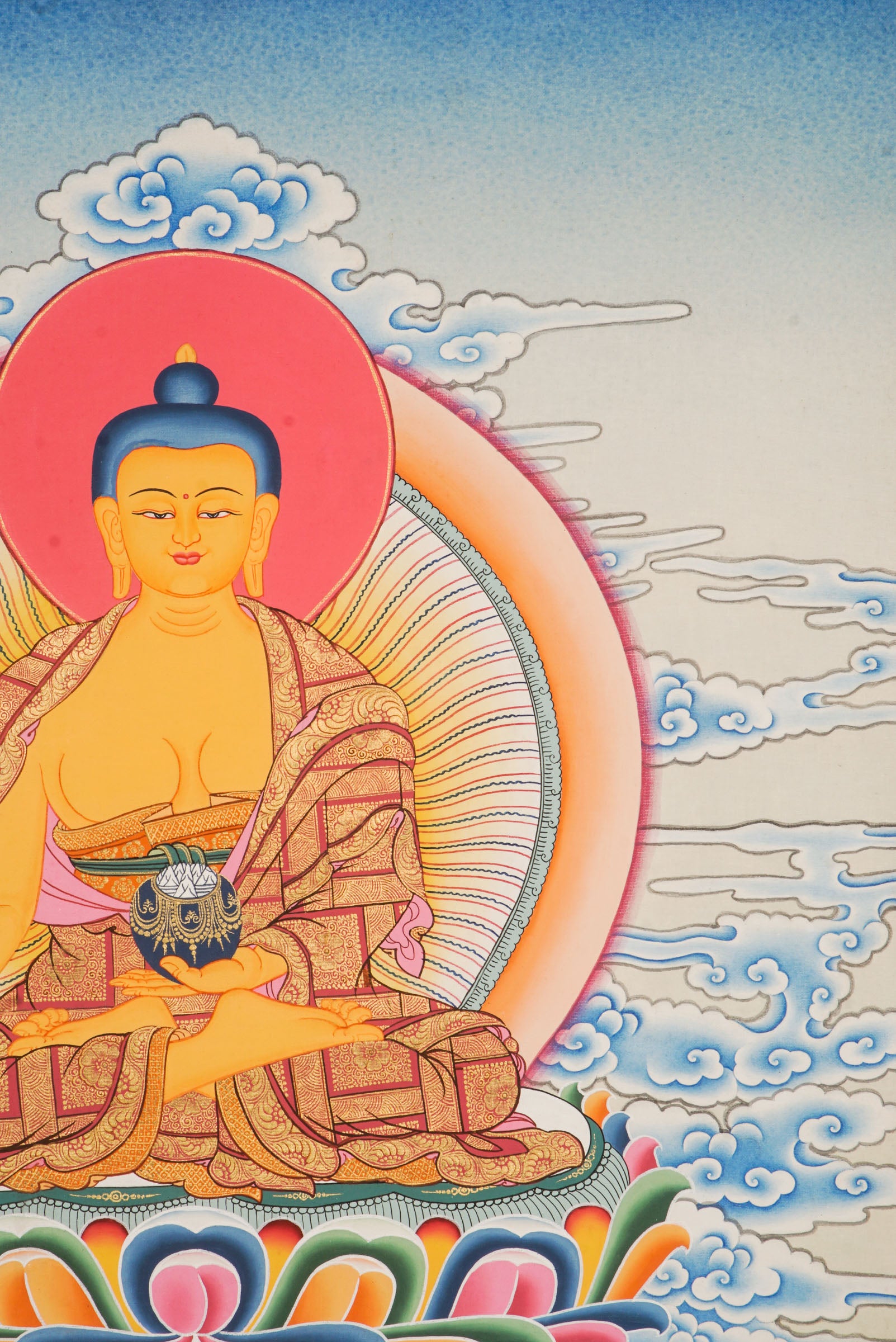 Using traditional techniques this hand-painted Shakyamuni Buddha Thangka is created by skilled Nepali artisans using 24k gold and natural pigments.