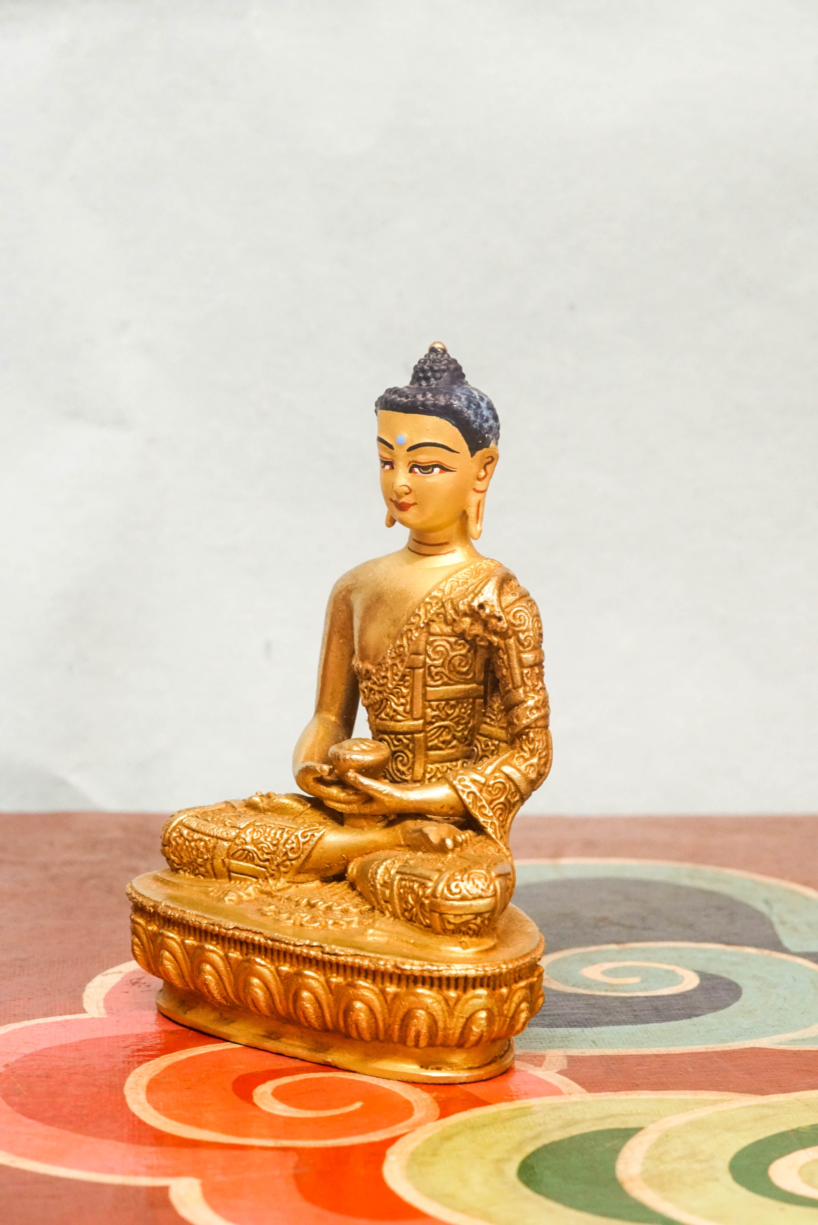 Amitabha Buddha seated in meditation, reflecting the Dharma and principles of compassion, wisdom, and awakening.