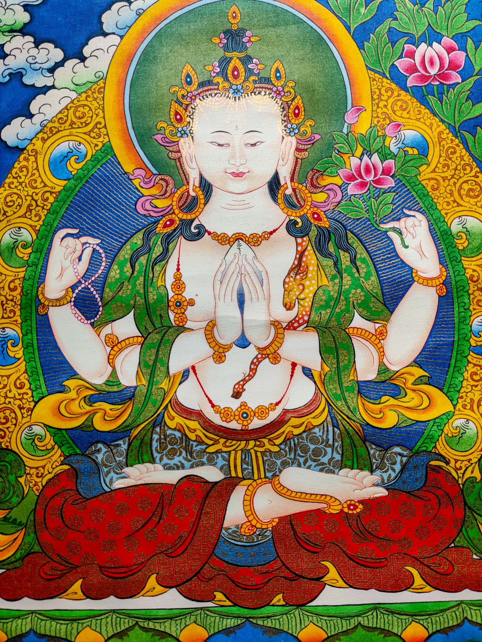 This Handmade Tibetan Thangka Painting of Chengresi is a stunning piece of art, crafted by skilled Tibetan artisans.