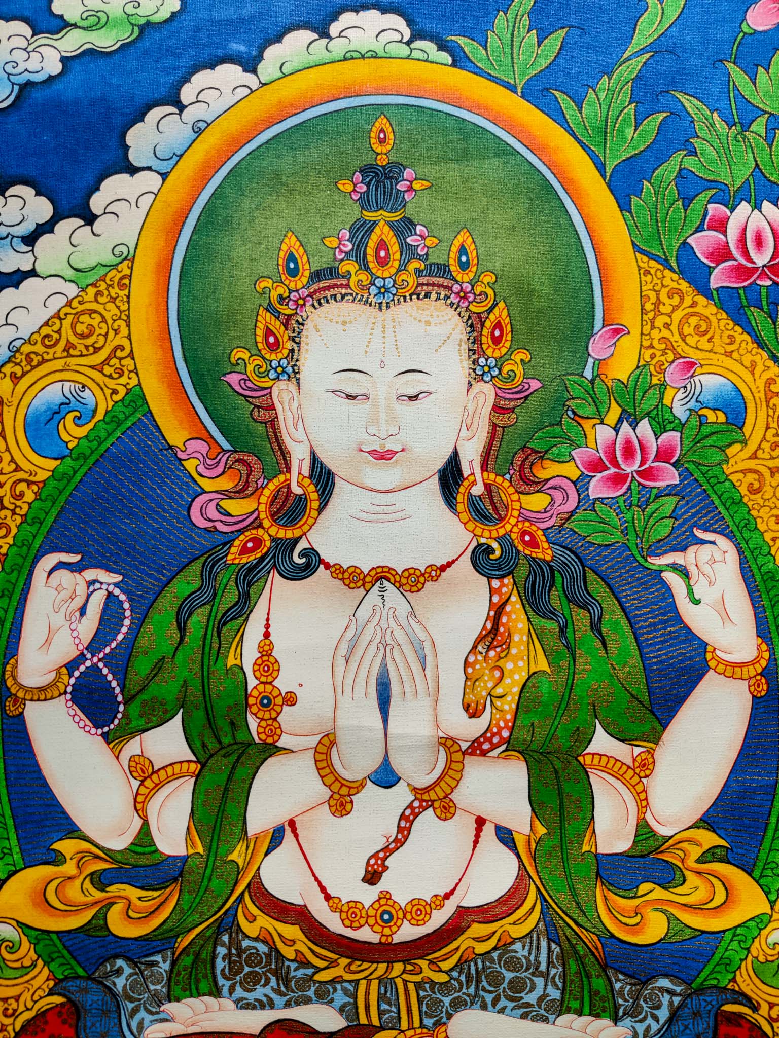 This Handmade Tibetan Thangka Painting of Chengresi is a stunning piece of art, crafted by skilled Tibetan artisans.