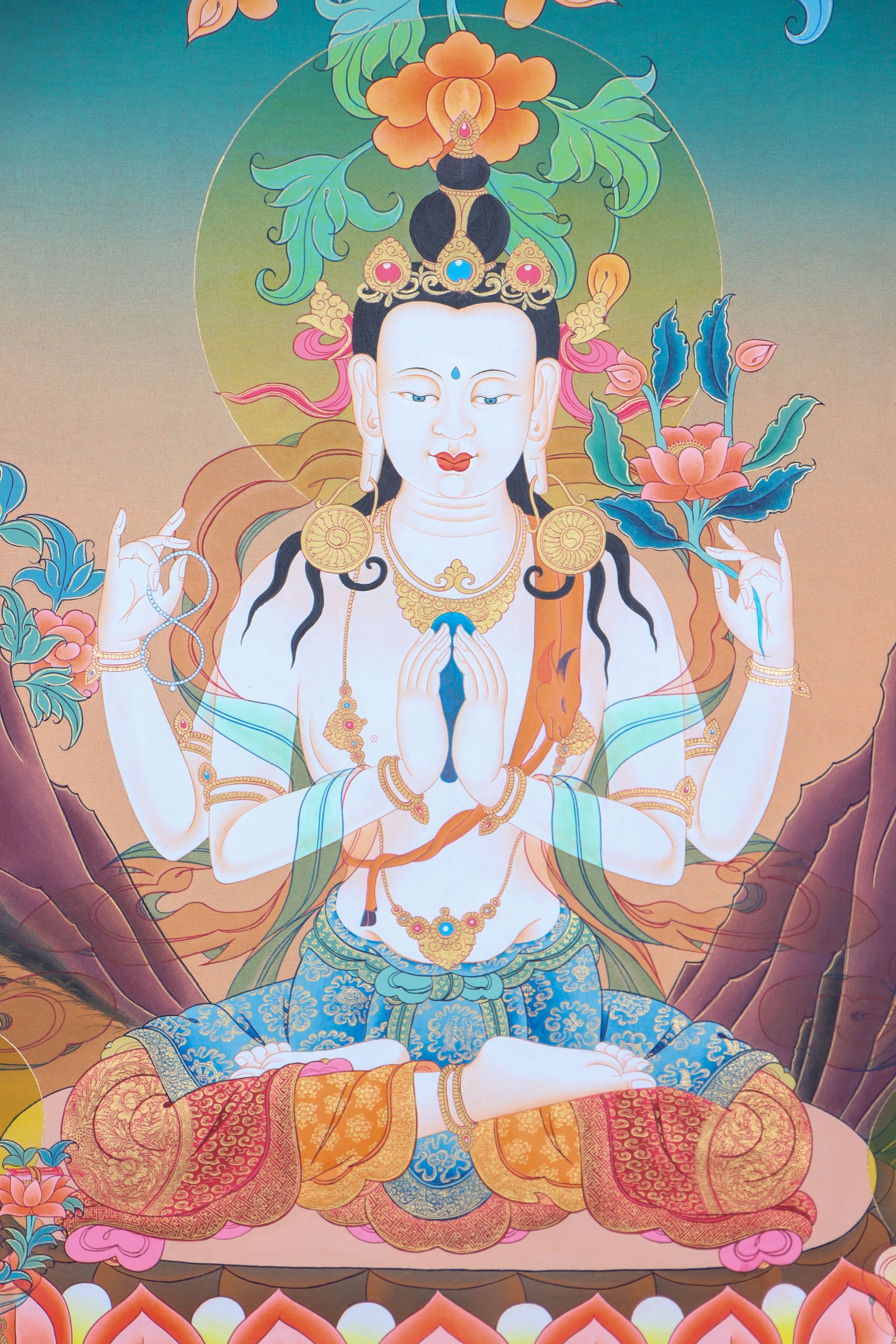 Chenrezig, the deity of compassion in Tibetan Buddhism, is beautifully depicted in this hand-painted Thangka made with natural mineral pigments. A spiritual and artistic piece, it serves as a reminder of compassion and a powerful aid for meditation and mindfulness.