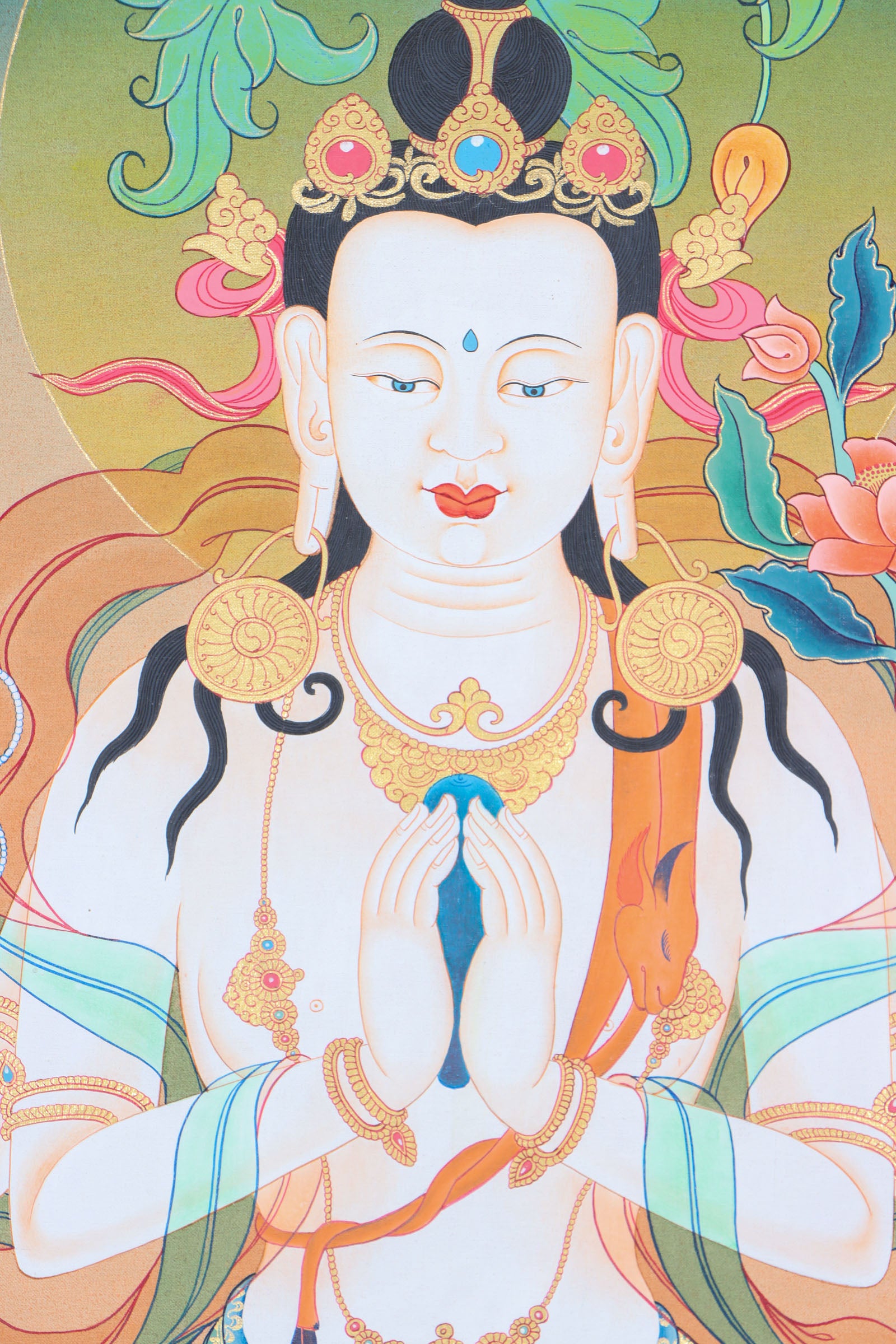 Chenrezig, the deity of compassion in Tibetan Buddhism, is beautifully depicted in this hand-painted Thangka made with natural mineral pigments. A spiritual and artistic piece, it serves as a reminder of compassion and a powerful aid for meditation and mindfulness.