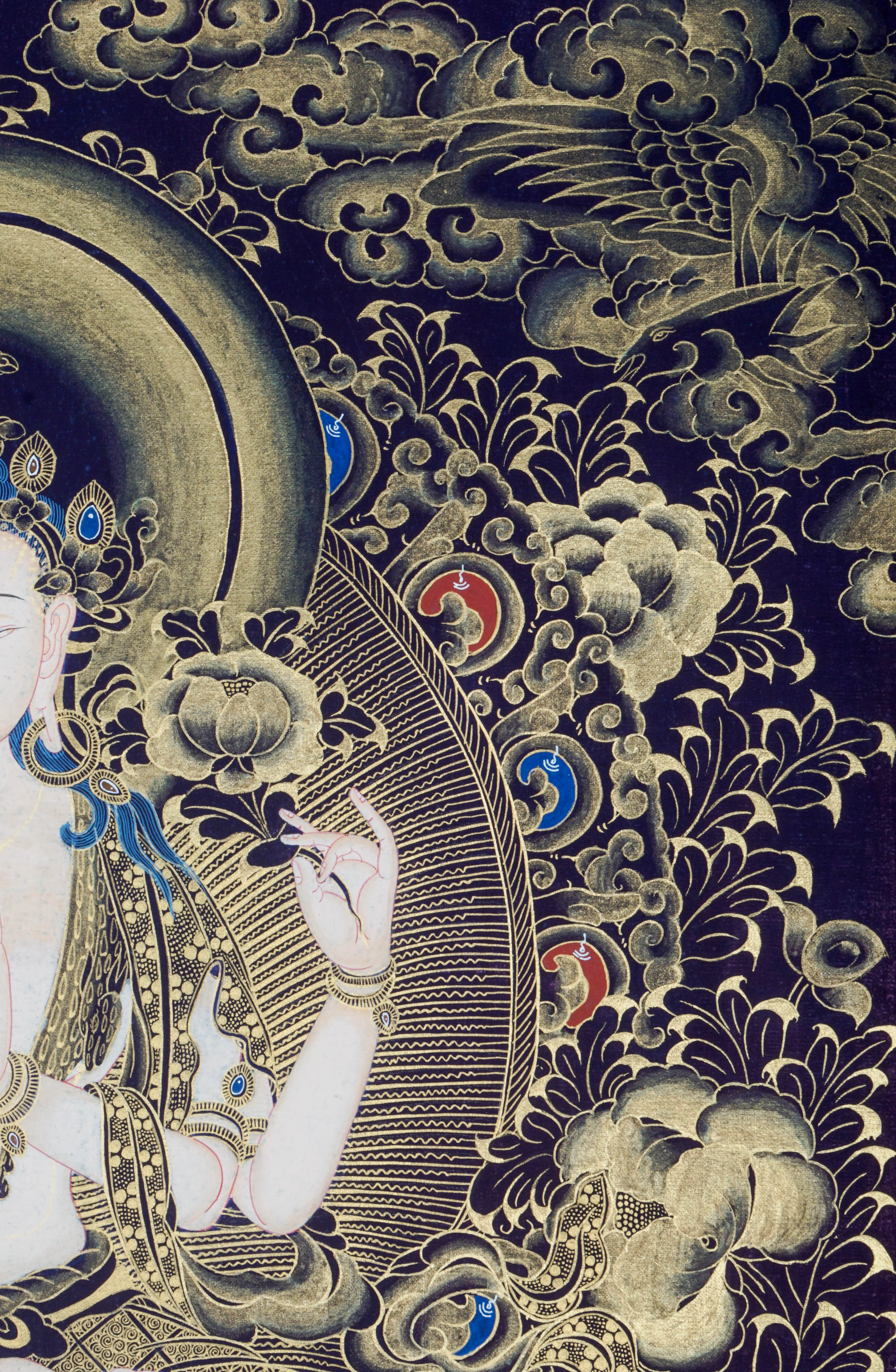 The Chengresi Thangka Painting portrays Chenrezig, the Bodhisattva of Compassion in Tibetan Buddhism, symbolizing love, healing, and kindness through sacred detail and traditional artistry.