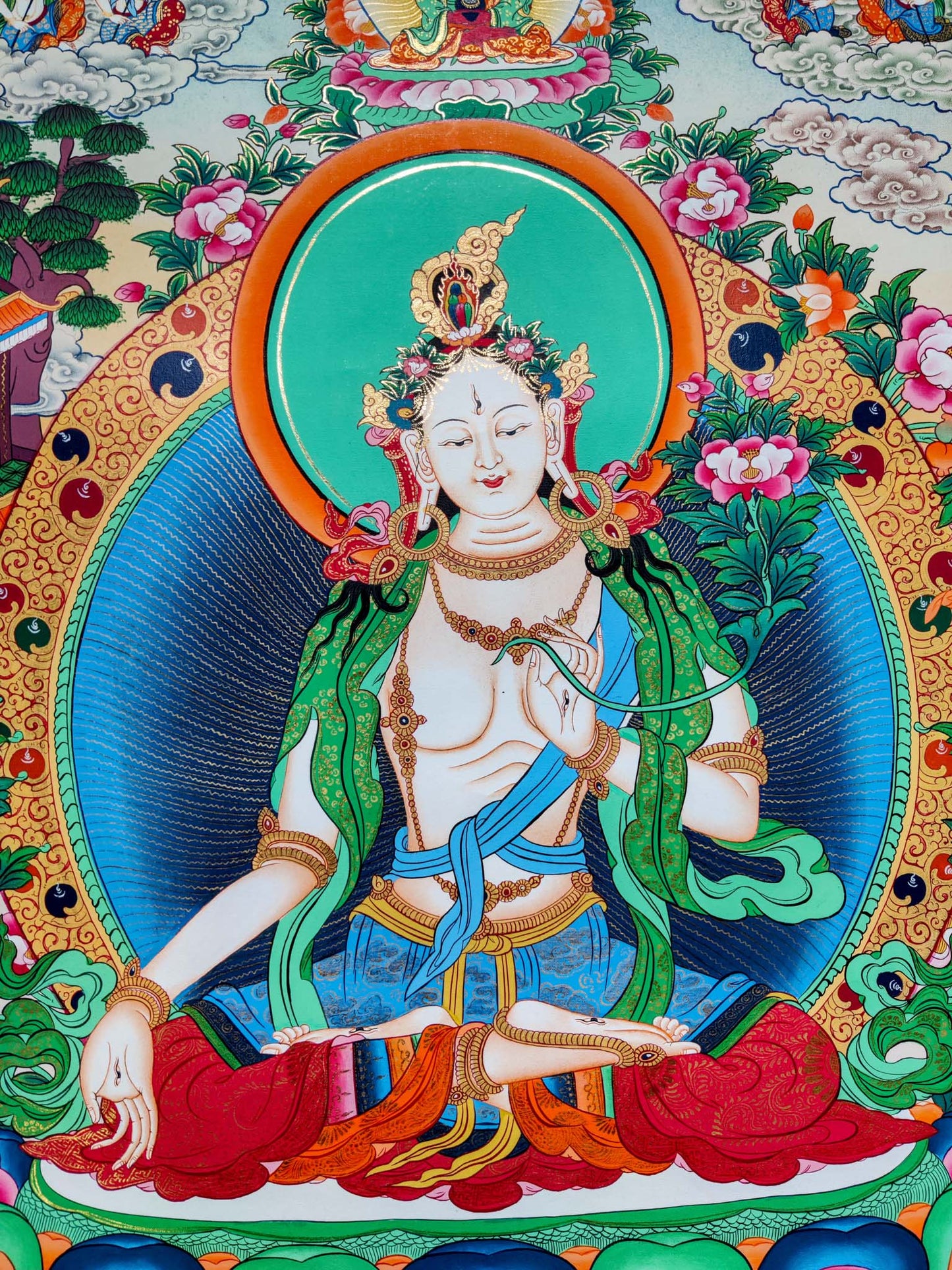 The White Thangka Painting is hand-painted in 24k gold leaf accents, as a sign of heavenly blessings and purity.