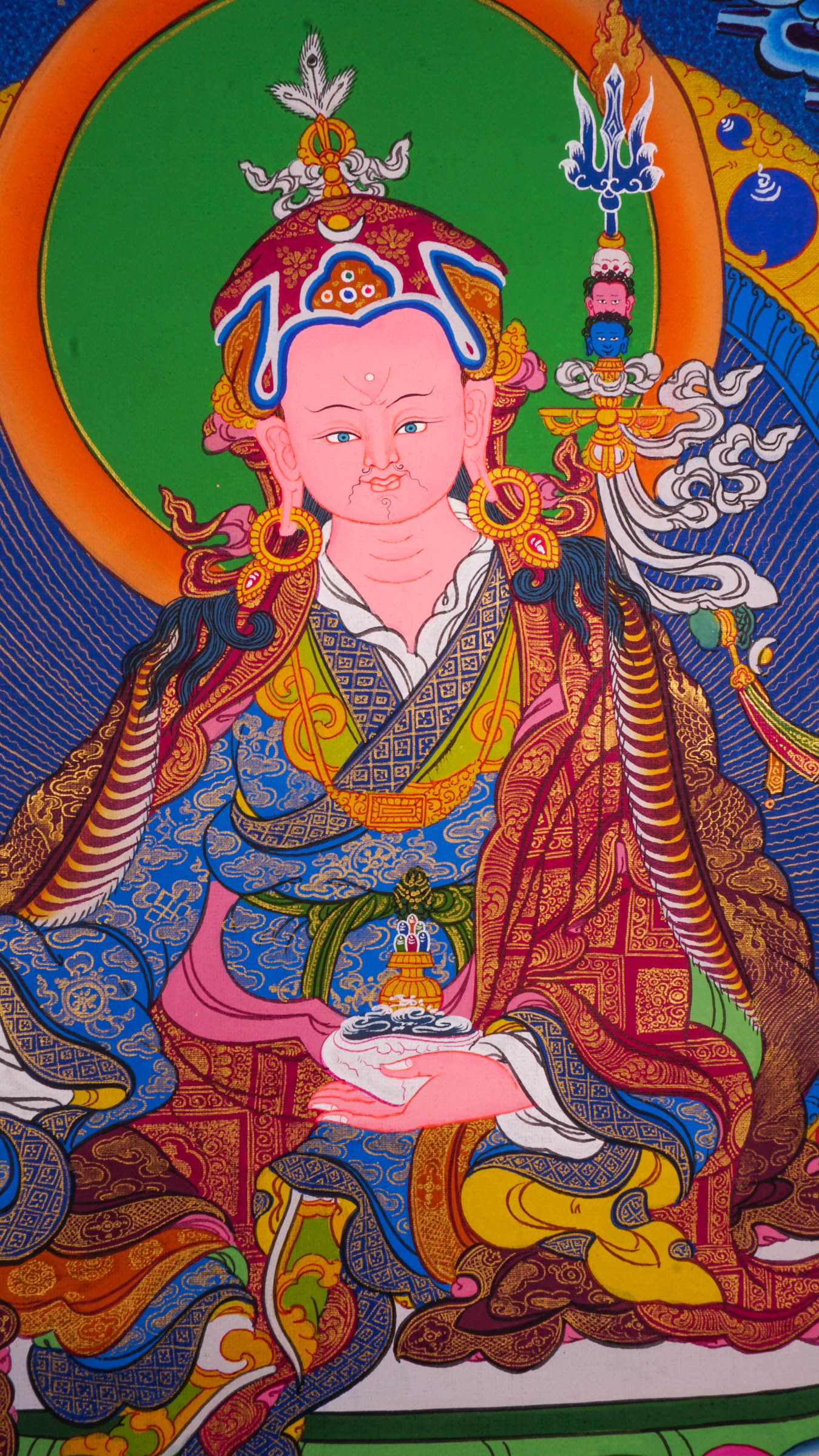 The Thangka artwork depicting Guru Rinpoche, a symbol representing Buddhist teachings and traditions.