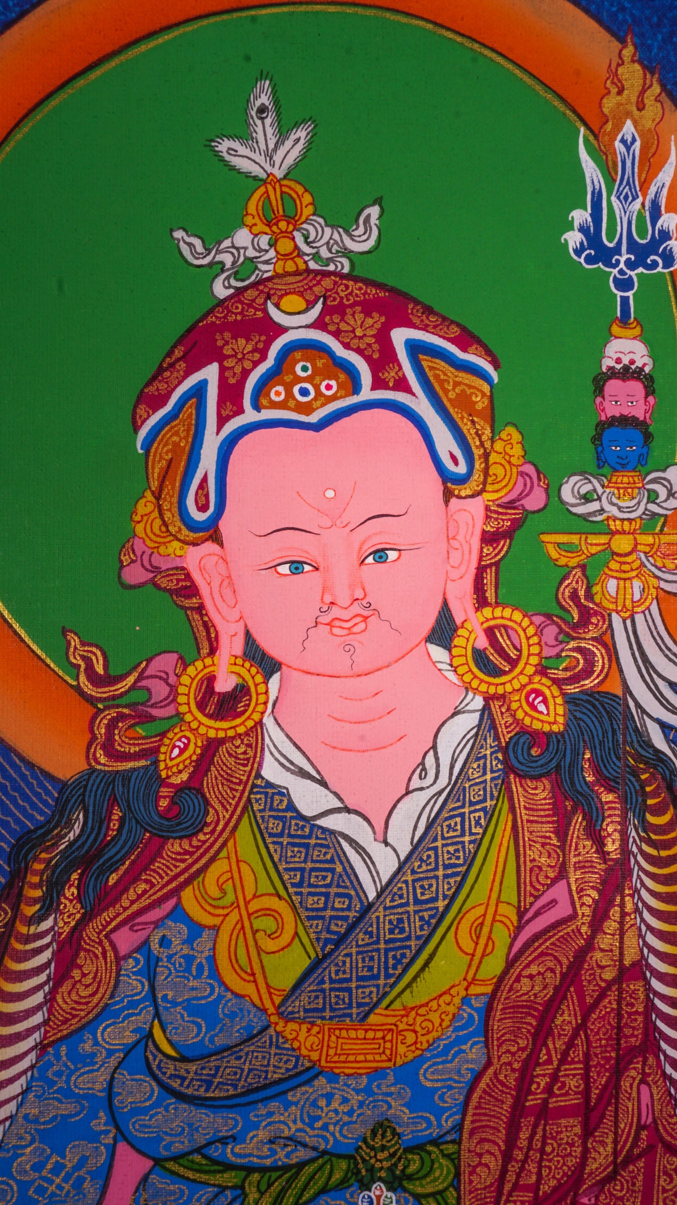 The Thangka artwork depicting Guru Rinpoche, a symbol representing Buddhist teachings and traditions.