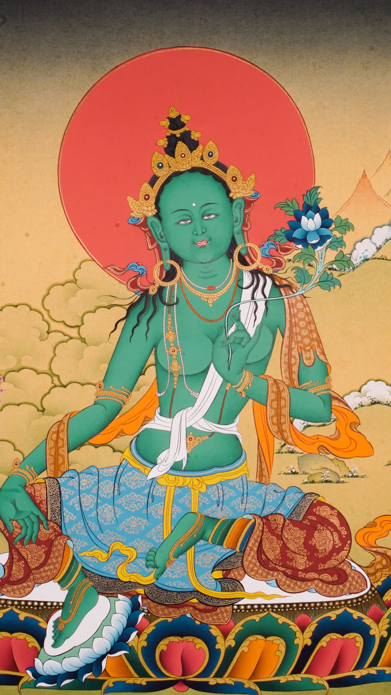 The Green Tara Thangka Painting features the compassionate Tibetan Buddhist goddess known for her swift protection and fearless energy. Hand-painted using traditional methods and natural pigments, this genuine Thangka radiates Green Tara’s benevolence and is a powerful symbol of courage, healing, and divine support.