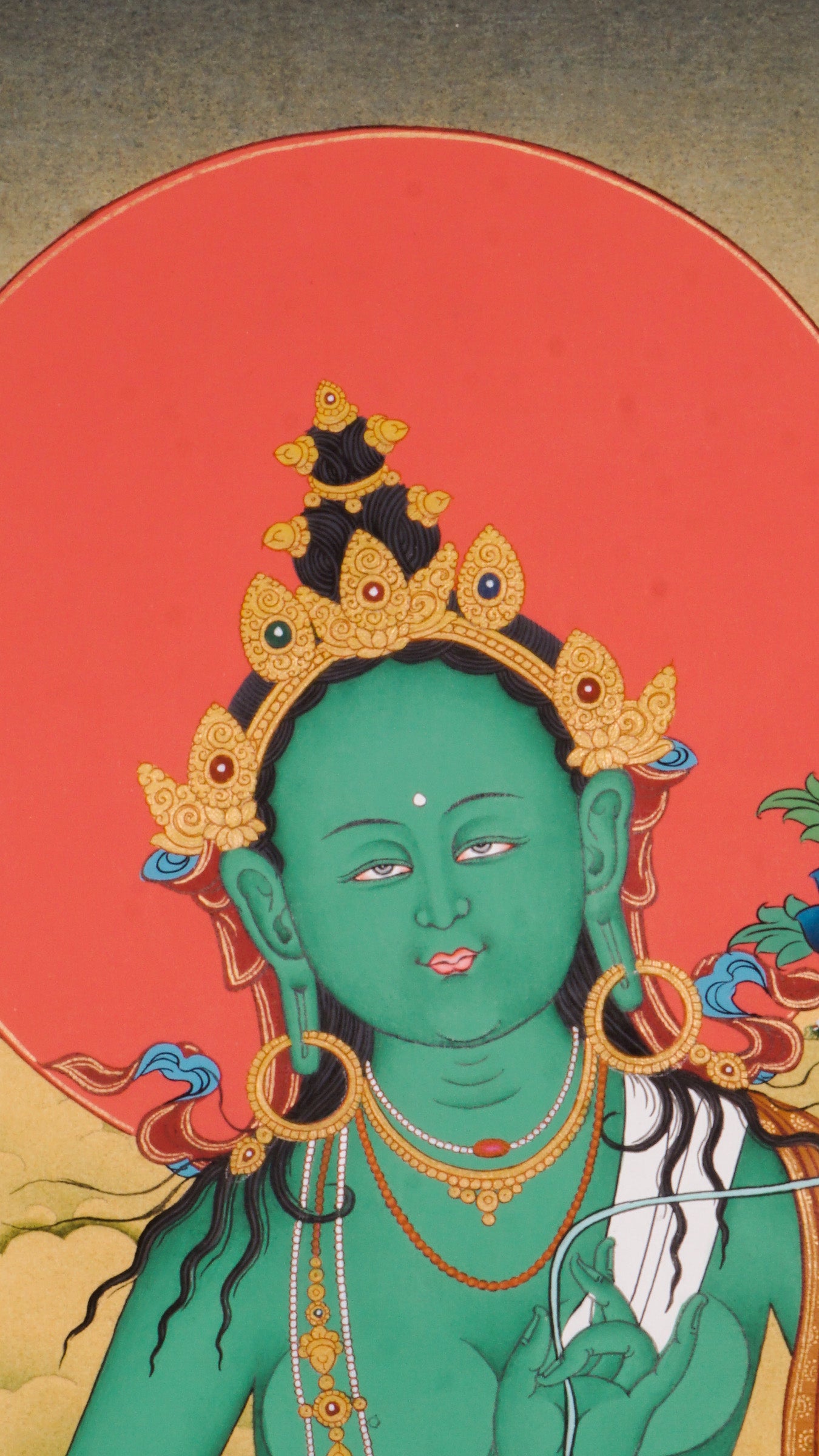 The Green Tara Thangka Painting features the compassionate Tibetan Buddhist goddess known for her swift protection and fearless energy. Hand-painted using traditional methods and natural pigments, this genuine Thangka radiates Green Tara’s benevolence and is a powerful symbol of courage, healing, and divine support.