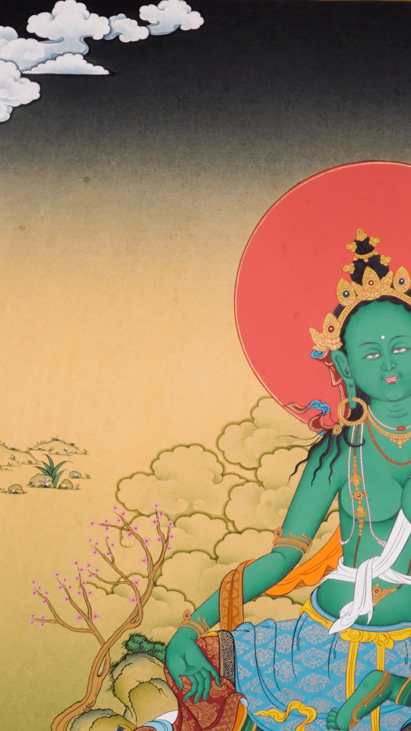 The Green Tara Thangka Painting features the compassionate Tibetan Buddhist goddess known for her swift protection and fearless energy. Hand-painted using traditional methods and natural pigments, this genuine Thangka radiates Green Tara’s benevolence and is a powerful symbol of courage, healing, and divine support.