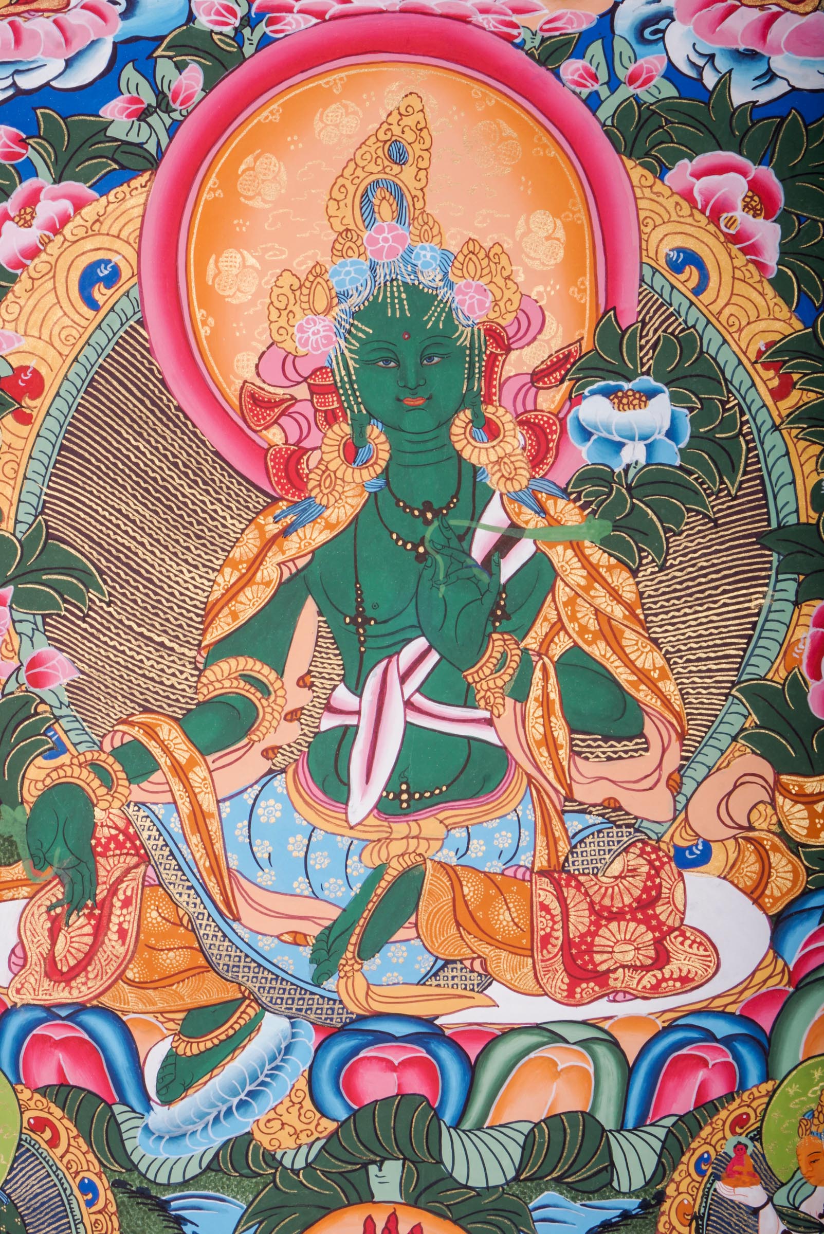 This genuine Tibetan Green Tara Thangka showcases the goddess of compassion and protection, hand-painted with natural pigments in traditional Himalayan style.