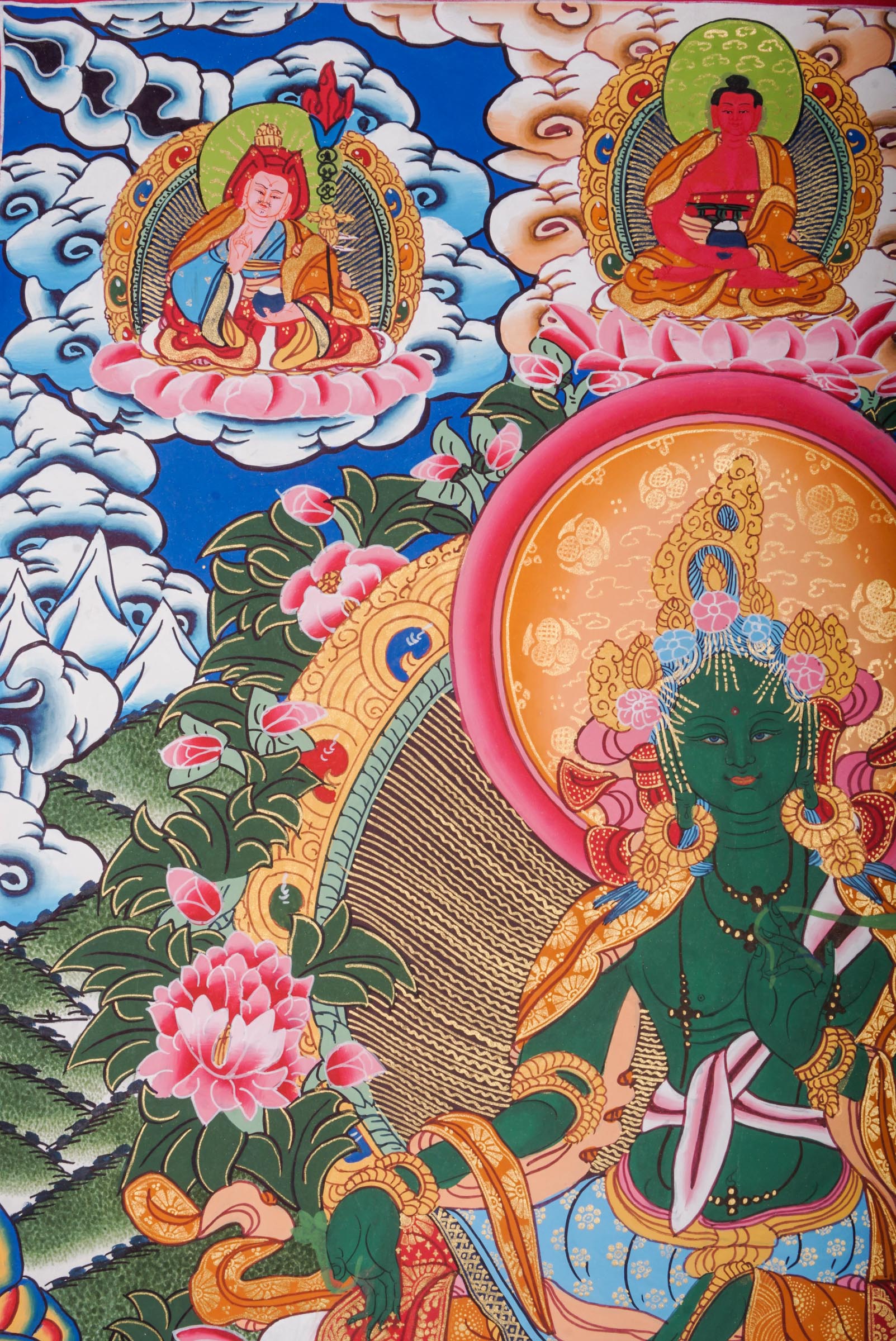 This genuine Tibetan Green Tara Thangka showcases the goddess of compassion and protection, hand-painted with natural pigments in traditional Himalayan style.