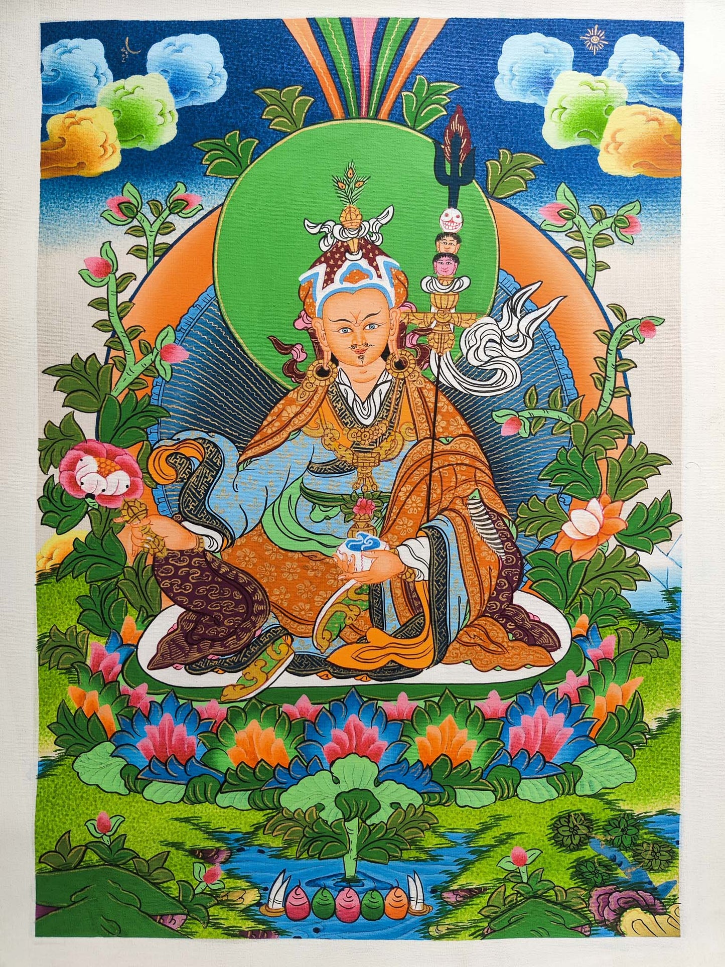 Guru Padmasambhava Thangka is a sacred depiction of a revered figure in Tibetan Buddhism, skillfully crafted by seasoned Tibetan artists using traditional methods