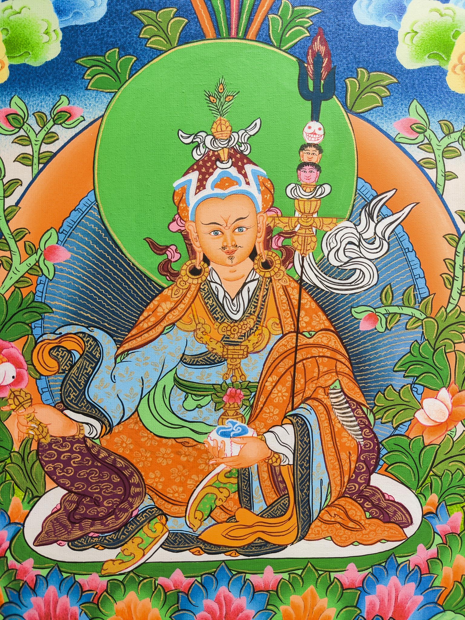 Guru Padmasambhava Thangka is a sacred depiction of a revered figure in Tibetan Buddhism, skillfully crafted by seasoned Tibetan artists using traditional methods