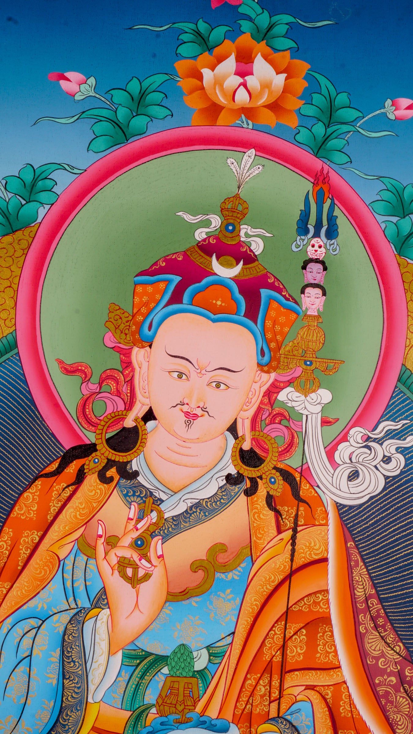 The Thangka artwork depicting Guru Rinpoche, a symbol representing Buddhist teachings and traditions.