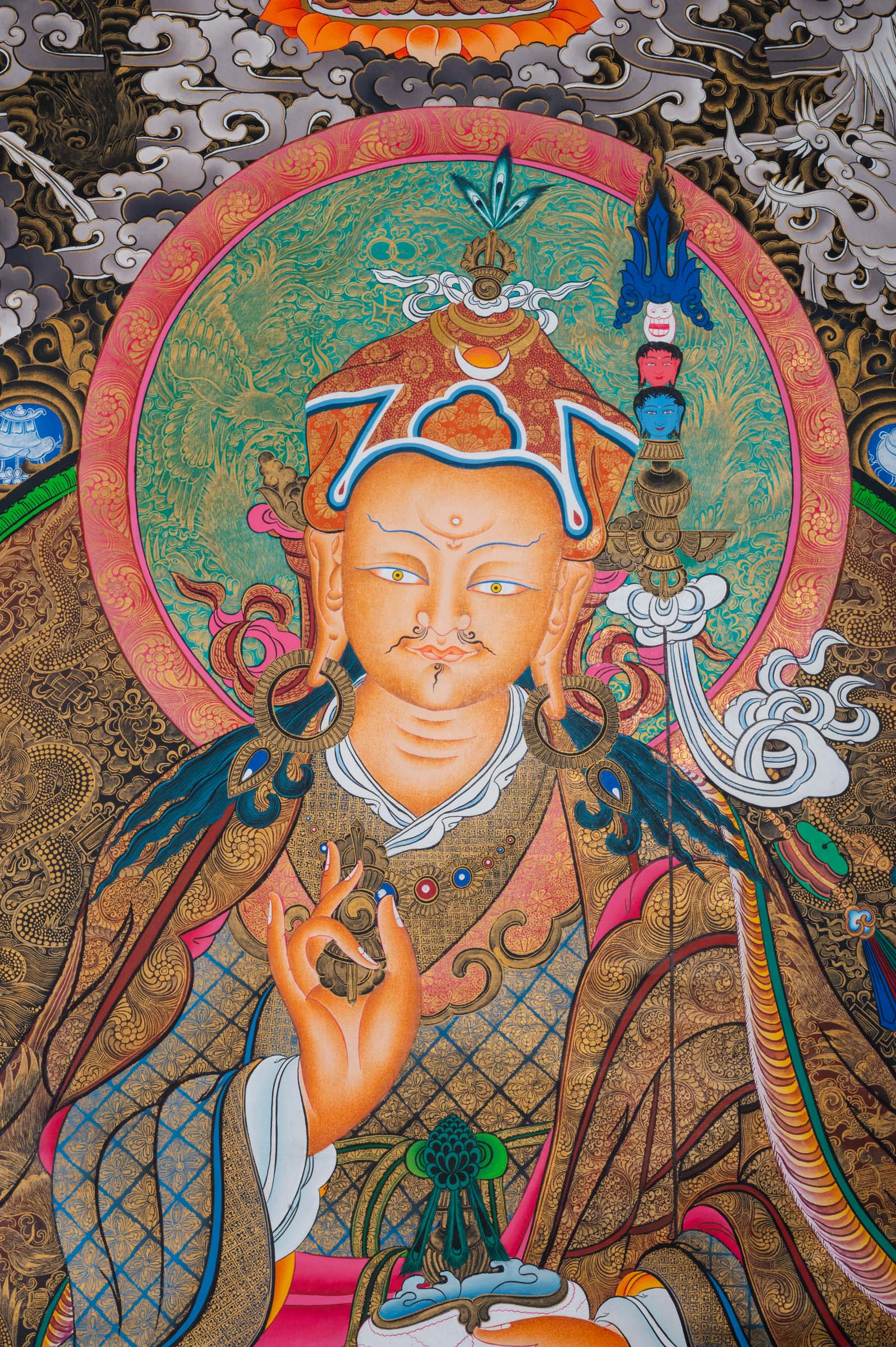 Exclusive Guru Rinpoche Thangka with central figure seated in meditation, two disciples below, and three deities above in Tibetan Buddhist art style.