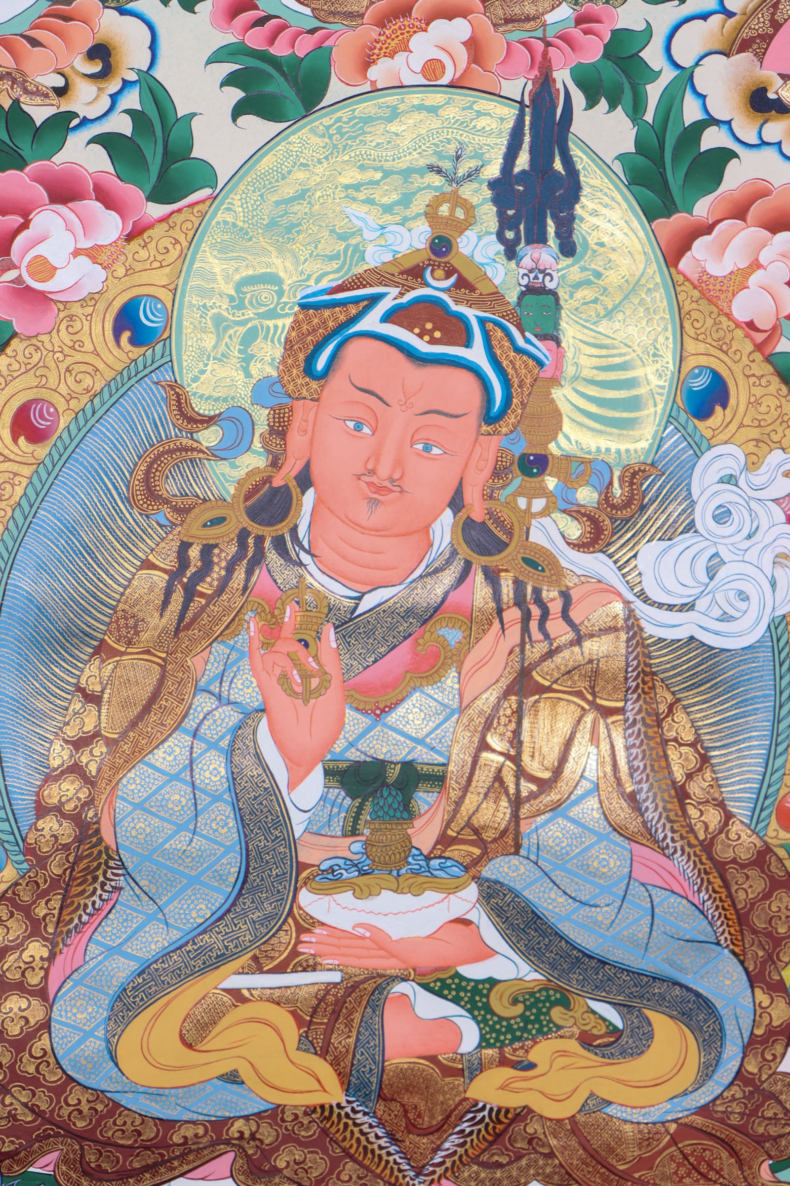 Guru Padmasambhava, the "Second Buddha," brought Buddhism to Tibet and is revered for his wisdom and spiritual power. This authentic Thangka, hand-painted with natural pigments, beautifully depicts his enlightened presence for meditation and devotion.