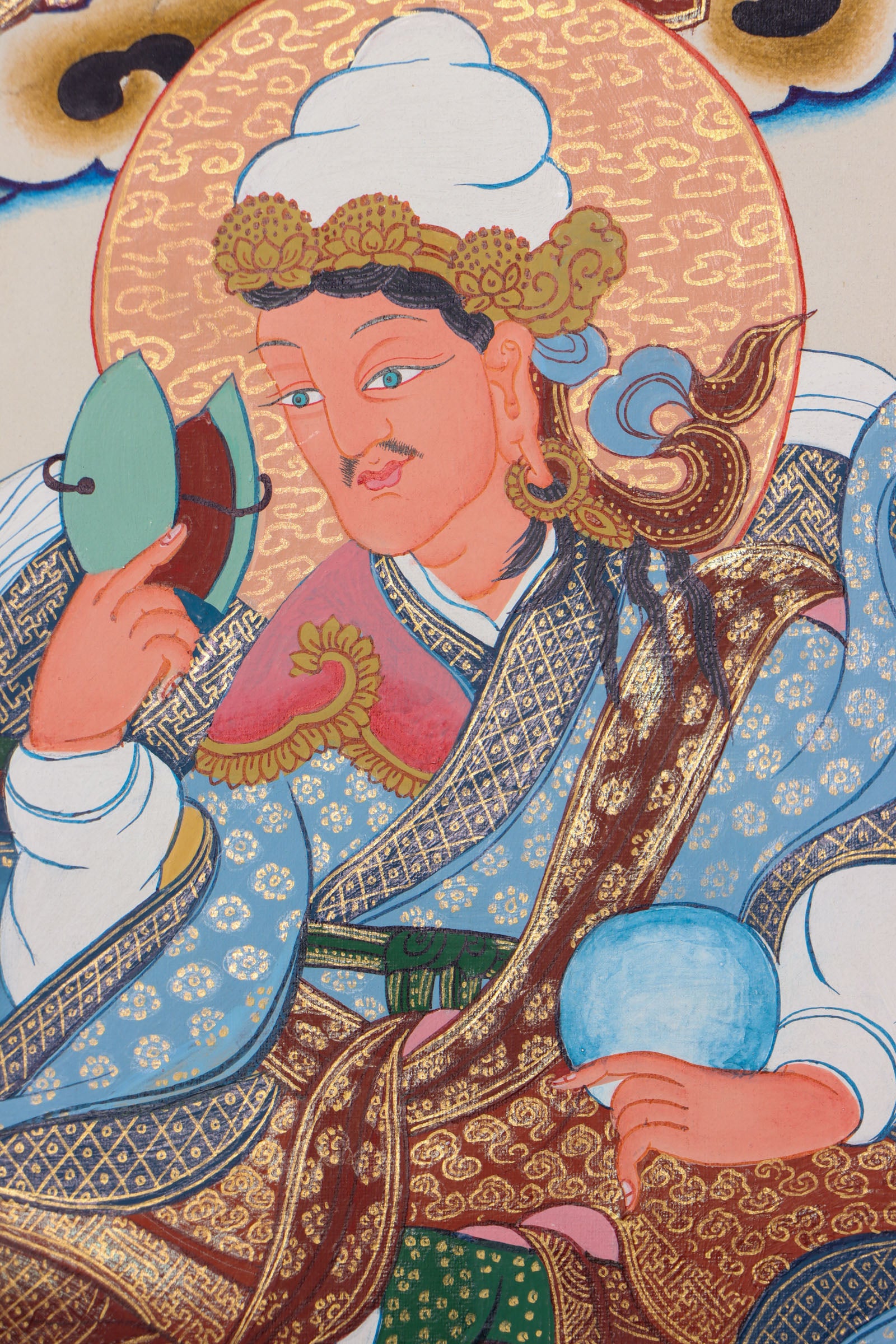 Guru Padmasambhava, the "Second Buddha," brought Buddhism to Tibet and is revered for his wisdom and spiritual power. This authentic Thangka, hand-painted with natural pigments, beautifully depicts his enlightened presence for meditation and devotion.