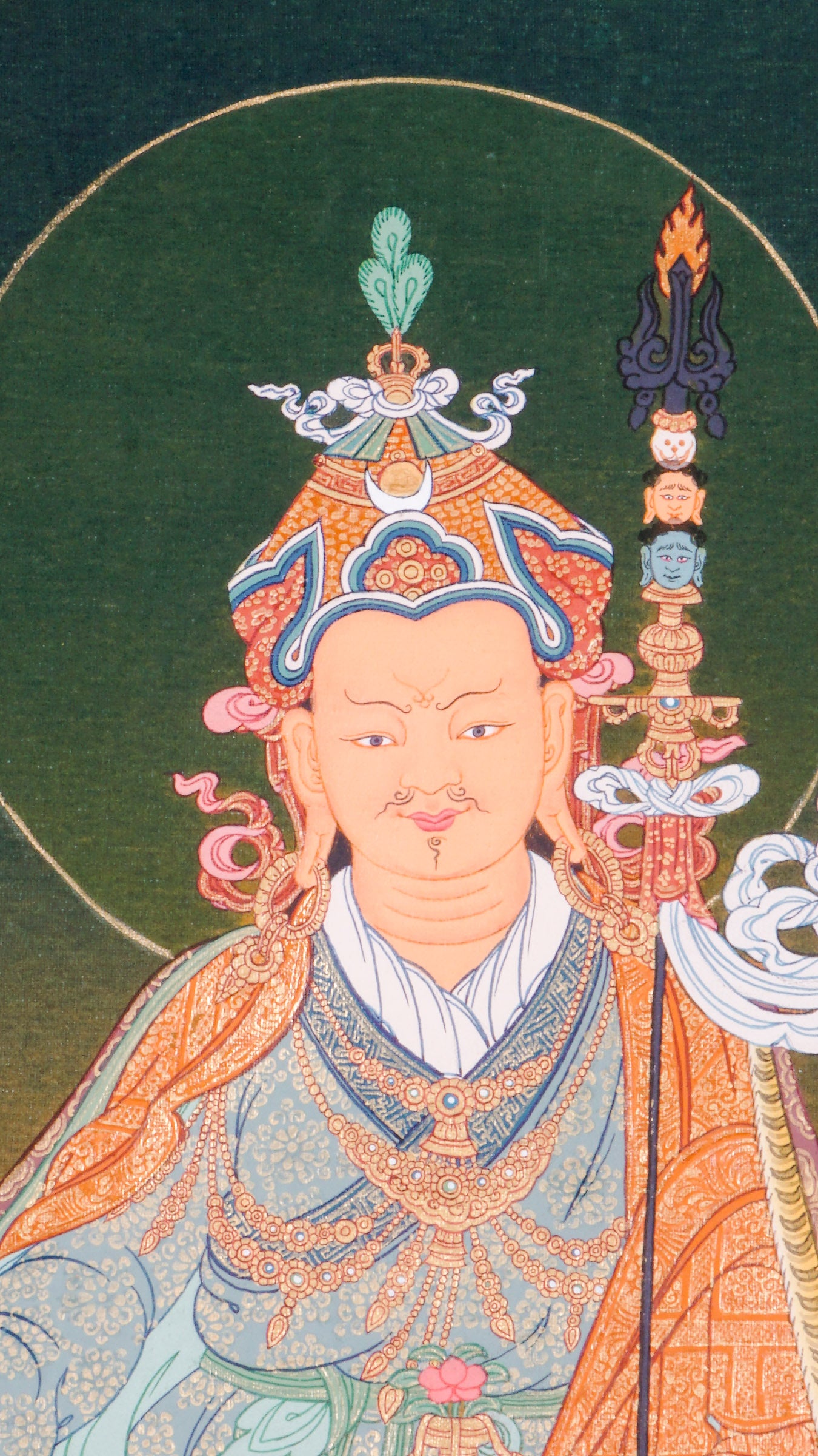 The Guru Rinpoche Thangka, hand-painted using traditional techniques and natural pigments, honors Padmasambhava, the revered master who brought Buddhism to Tibet. This sacred Tibetan Buddhist thangka symbolizes wisdom, compassion, and spiritual protection, making it ideal for meditation, personal devotion, and authentic spiritual decor.