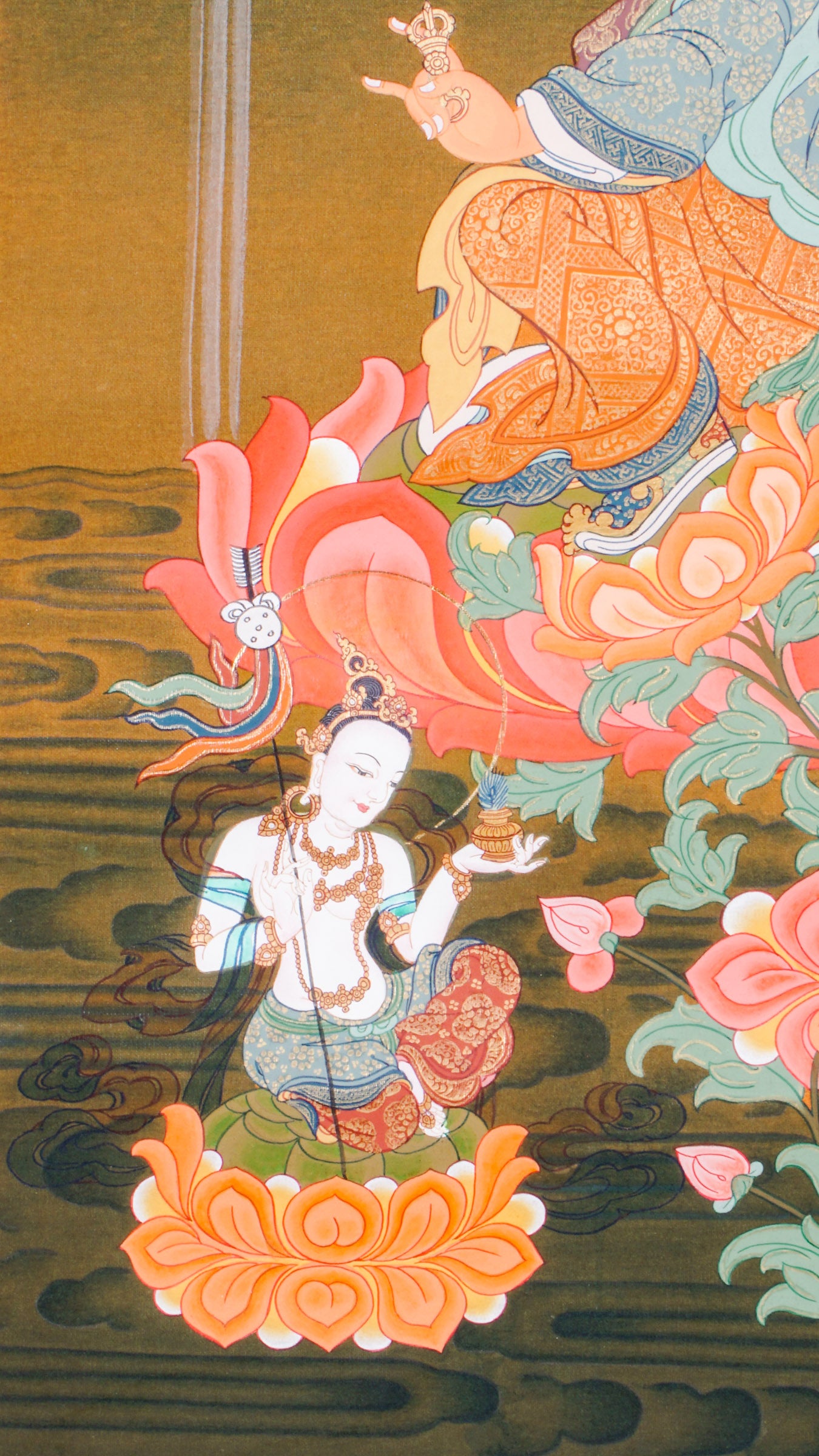 The Guru Rinpoche Thangka, hand-painted using traditional techniques and natural pigments, honors Padmasambhava, the revered master who brought Buddhism to Tibet. This sacred Tibetan Buddhist thangka symbolizes wisdom, compassion, and spiritual protection, making it ideal for meditation, personal devotion, and authentic spiritual decor.