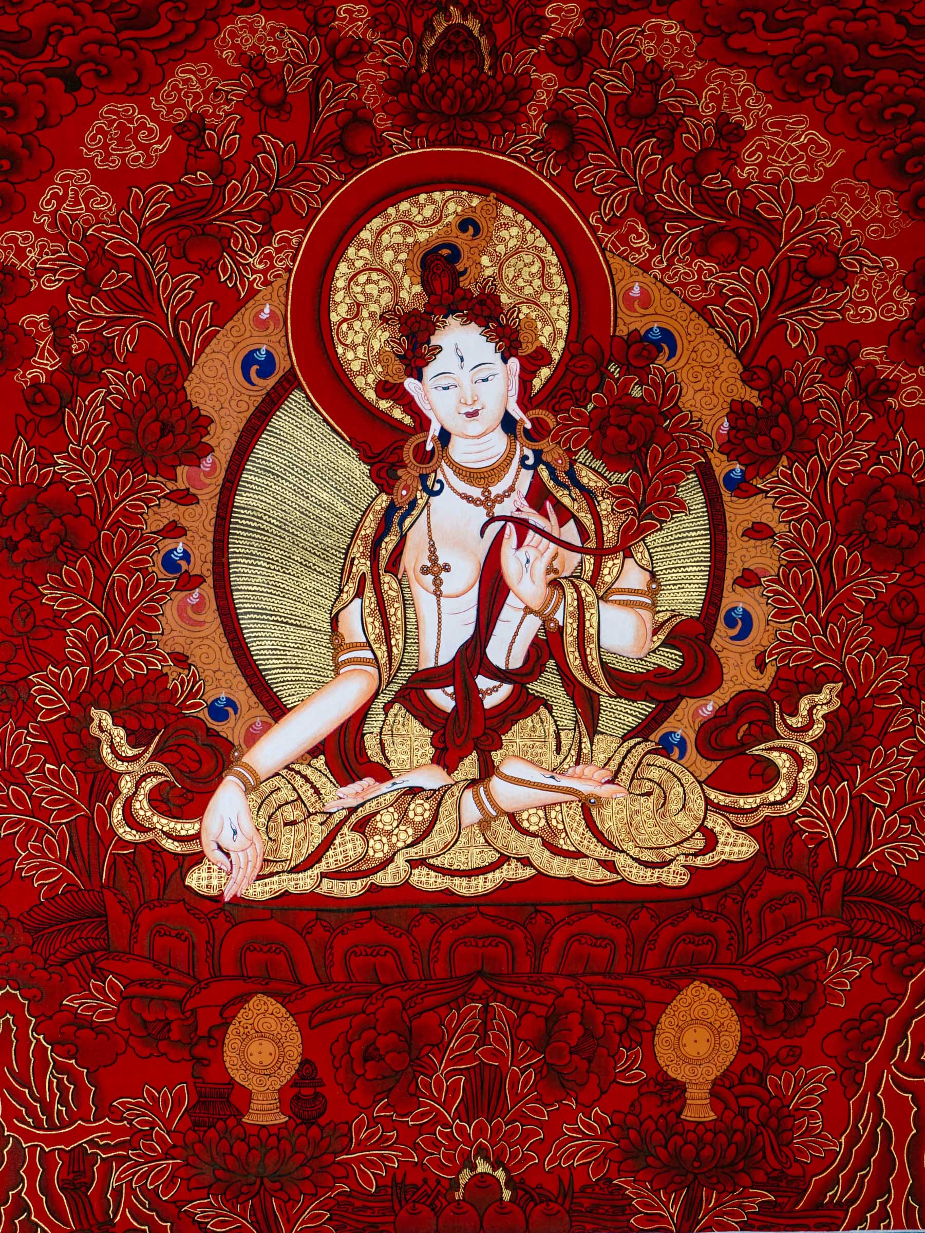 This White Tara Thangka features White Tara, a important figure in Tibetan Buddhism representing purity and calmness.