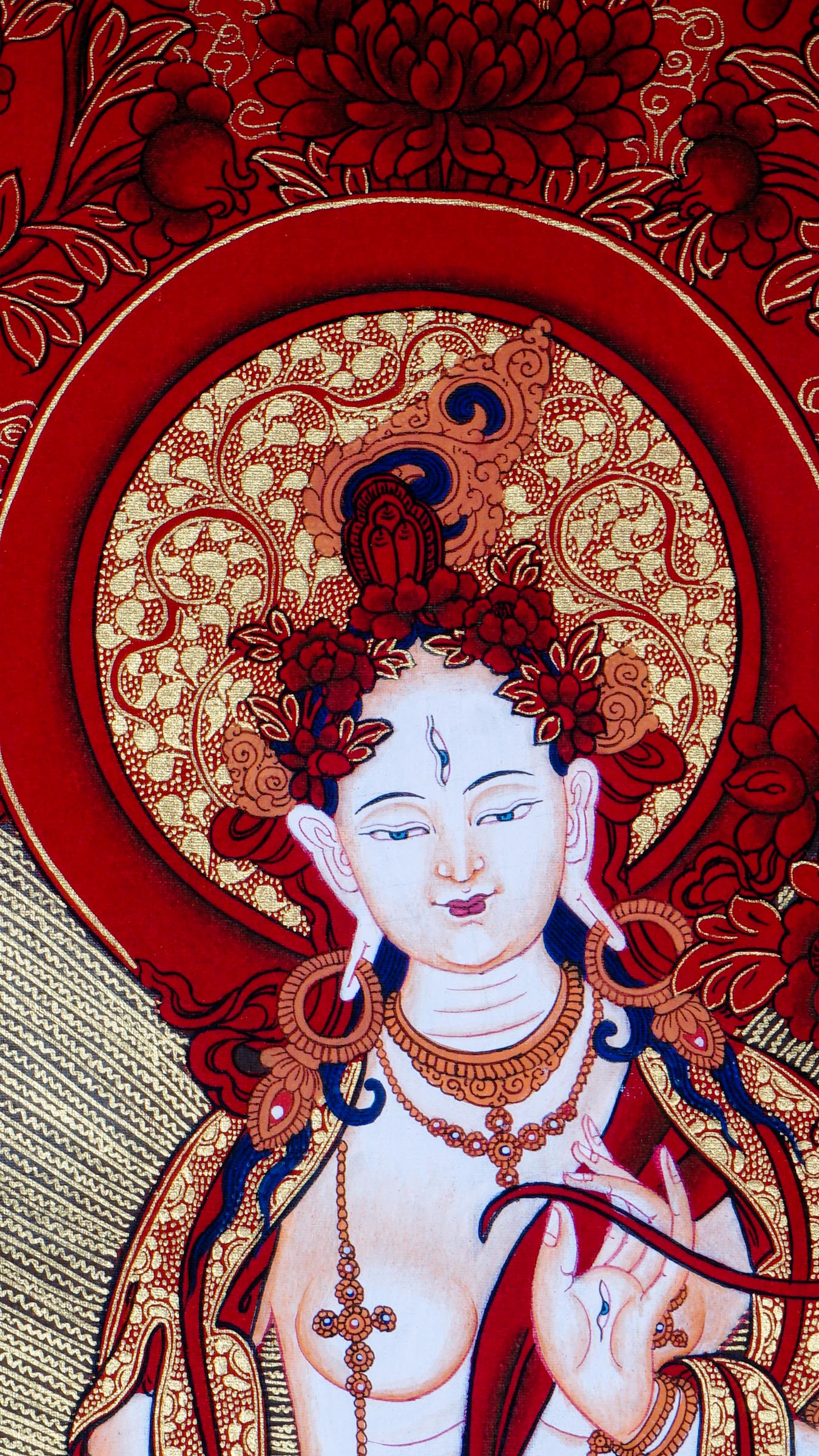 This White Tara Thangka features White Tara, a important figure in Tibetan Buddhism representing purity and calmness.