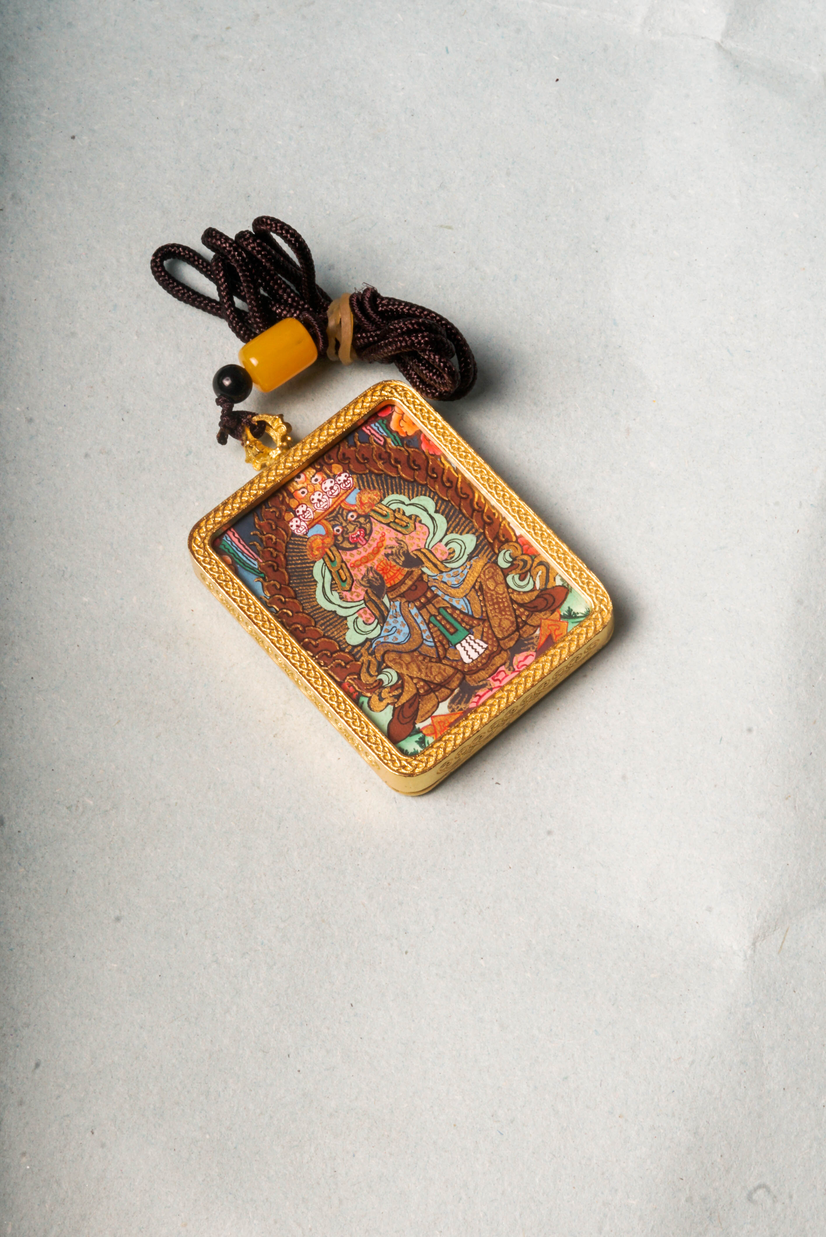 The Kali Ghau Thangka is a powerful depiction of the fierce goddess Kali, symbolizing the destruction of ego and protection on the spiritual path. Hand-painted with natural pigments, it serves as a portable source of strength, transformation, and divine feminine energy.
