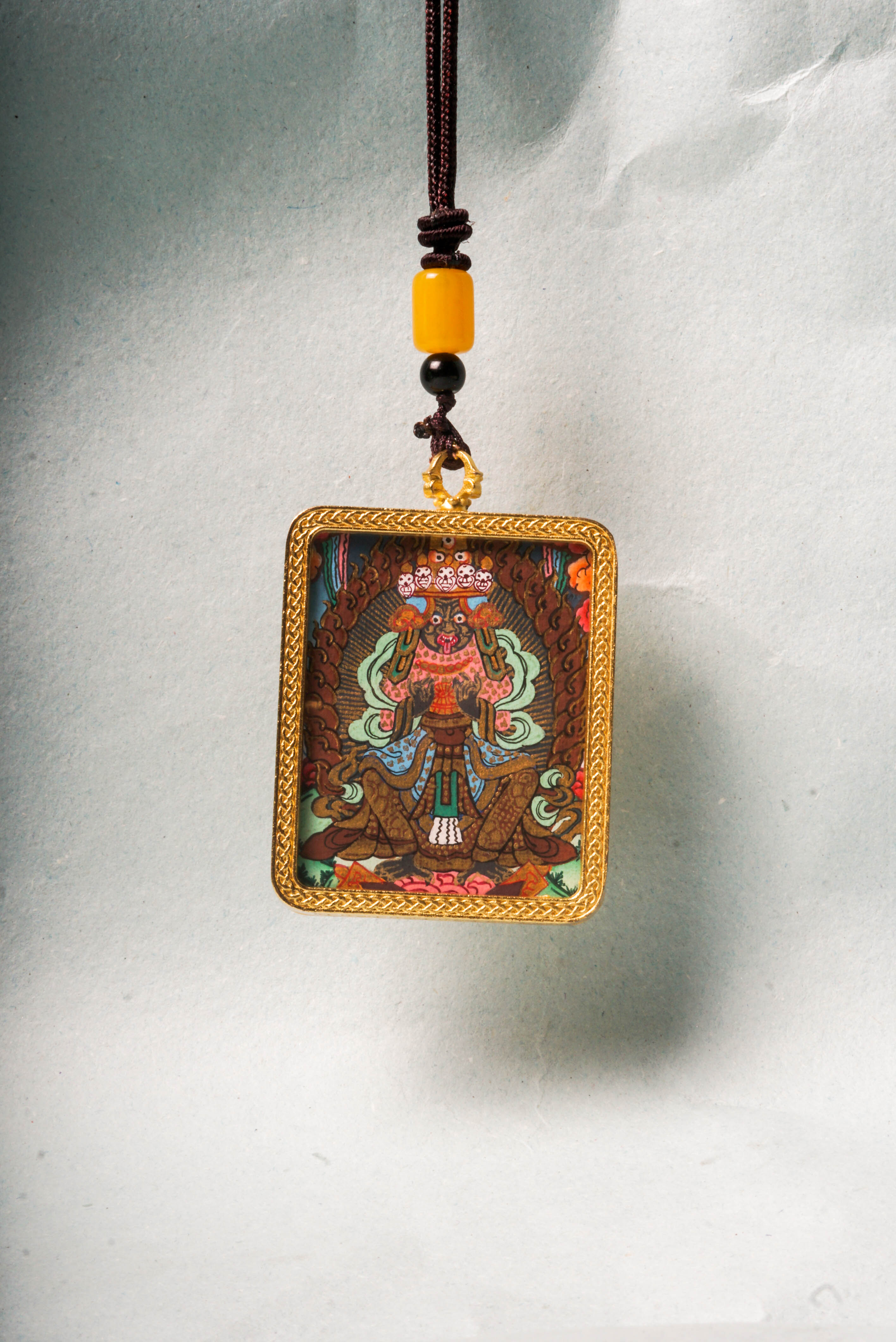 The Kali Ghau Thangka is a powerful depiction of the fierce goddess Kali, symbolizing the destruction of ego and protection on the spiritual path. Hand-painted with natural pigments, it serves as a portable source of strength, transformation, and divine feminine energy.
