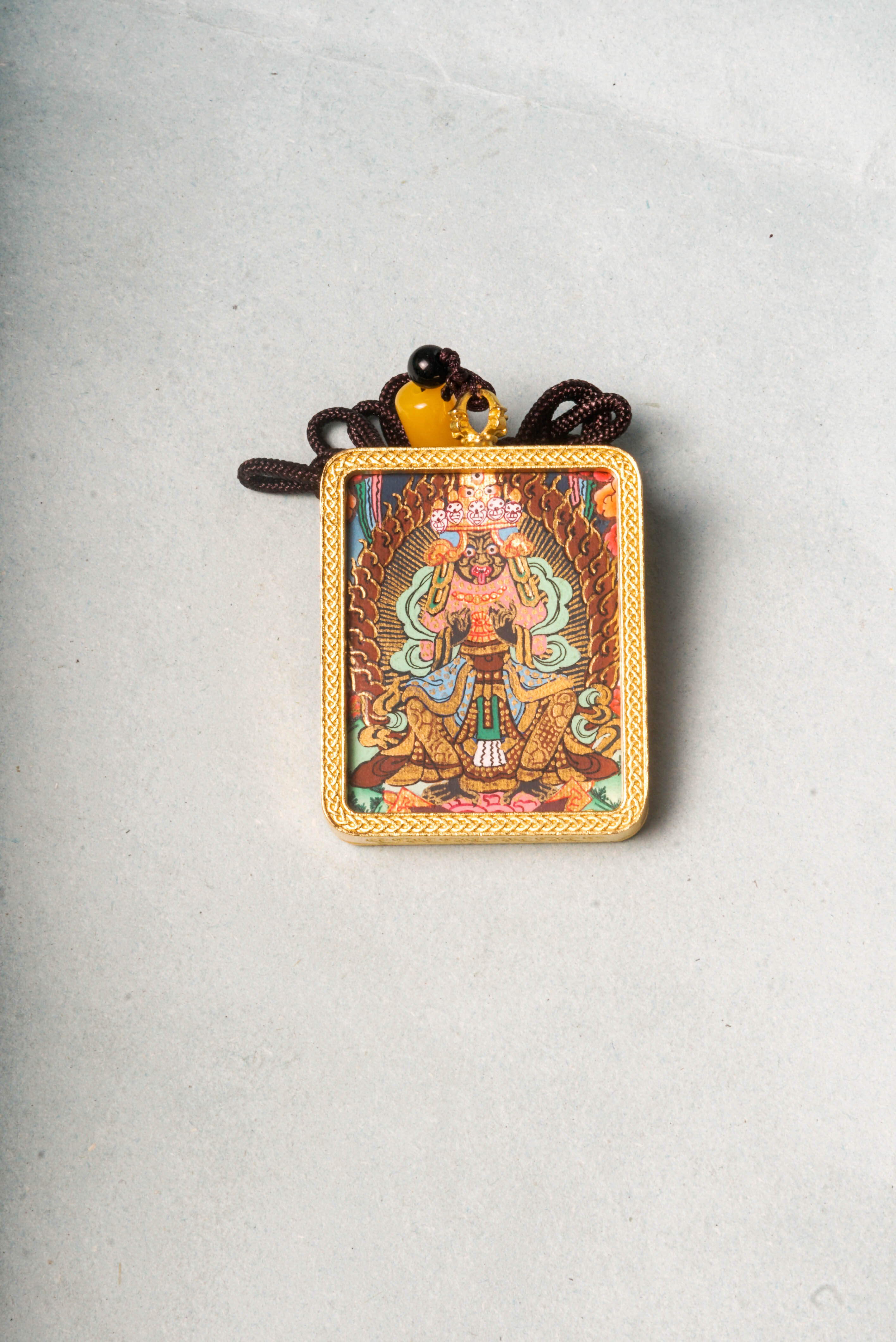 The Kali Ghau Thangka is a powerful depiction of the fierce goddess Kali, symbolizing the destruction of ego and protection on the spiritual path. Hand-painted with natural pigments, it serves as a portable source of strength, transformation, and divine feminine energy.
