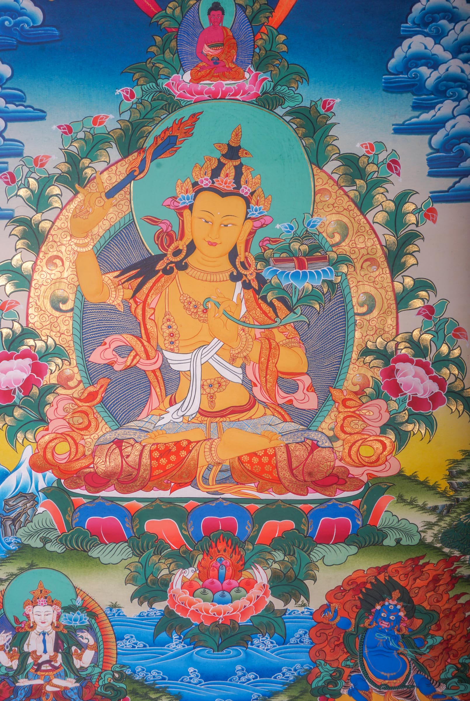 This handmade Manjushri Thangka Painting embodies the divine wisdom and beauty of Manjushri