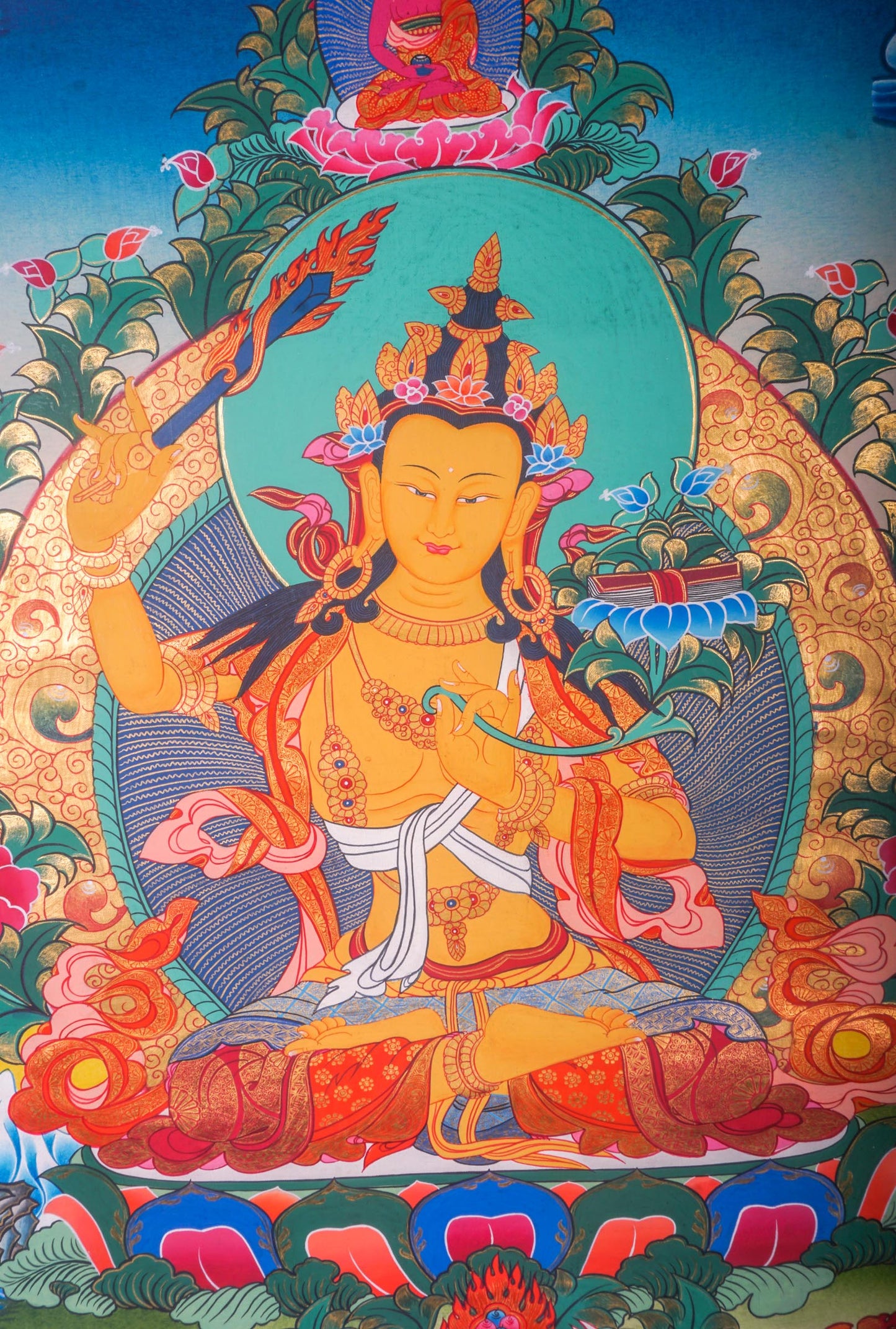 This handmade Manjushri Thangka Painting embodies the divine wisdom and beauty of Manjushri