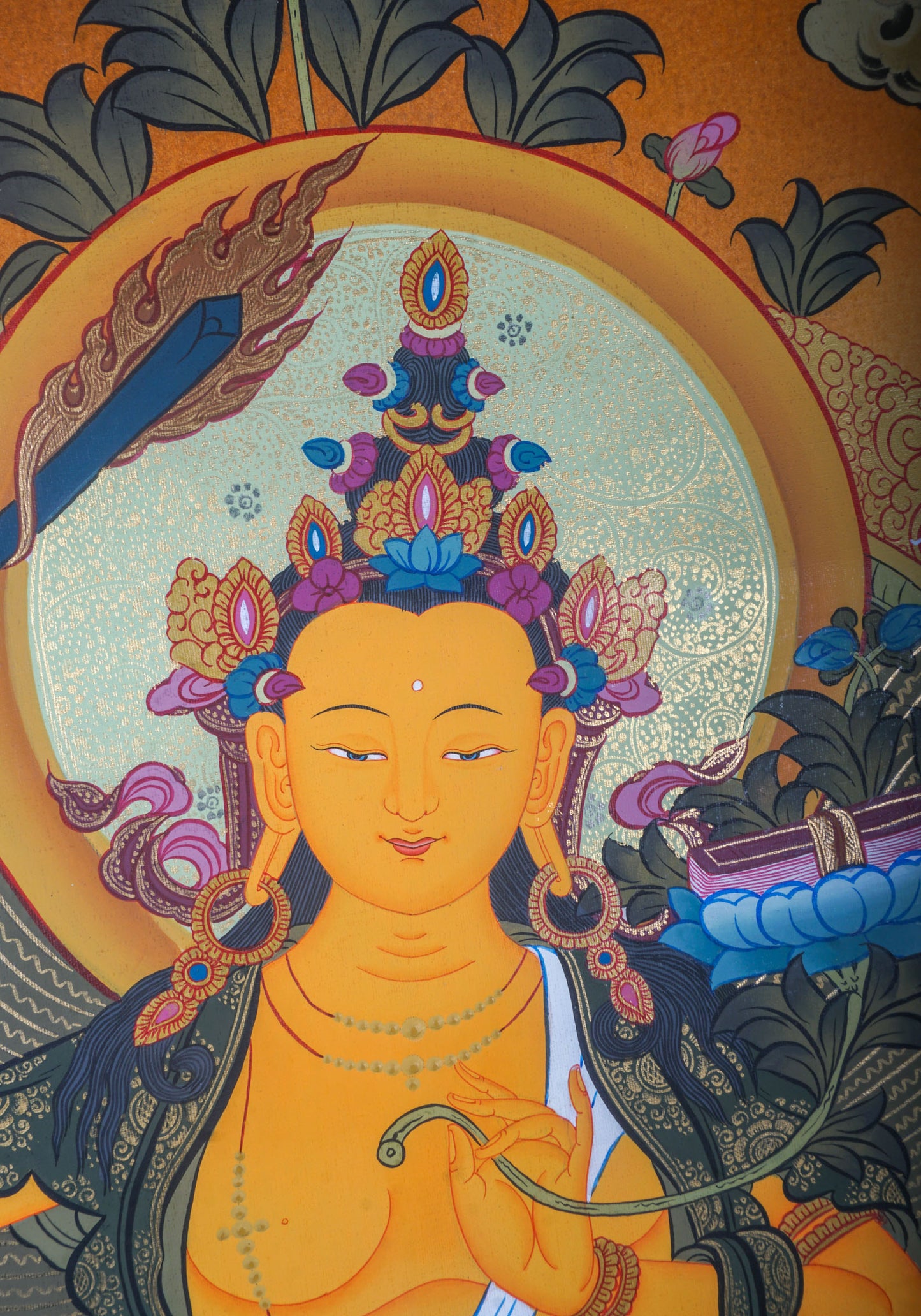 The Manjushri Thangka Painting showcases precision and vividness in the depiction of discernment and enlightenment.