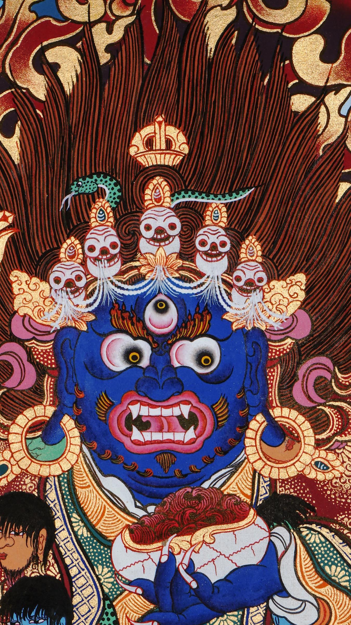 Hand-painted Mahākāla thangka from Kathmandu, Nepal depicting the wrathful protector deity with dark blue body, skull crown of five skulls, garland of severed heads, holding skull cup and curved knife, surrounded by red flames in traditional Tibetan Vajrayana style.