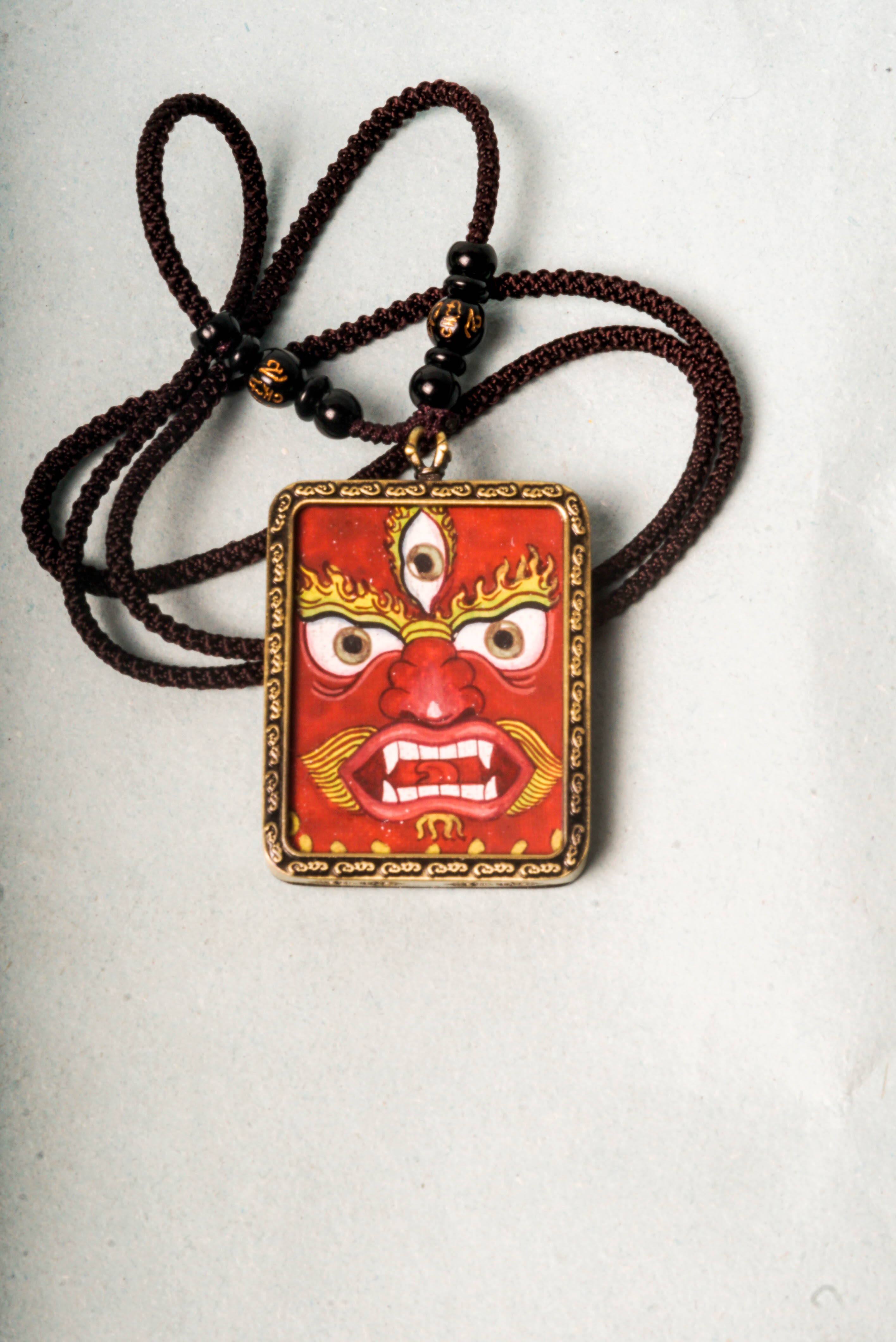 This genuine Mahakala Ghau Thangka embodies fierce protection and transformative power, hand-painted with natural mineral pigments to reflect his role as a Dharma guardian. A portable shrine and spiritual talisman, it supports meditation, wards off negativity, and strengthens your spiritual practice.
