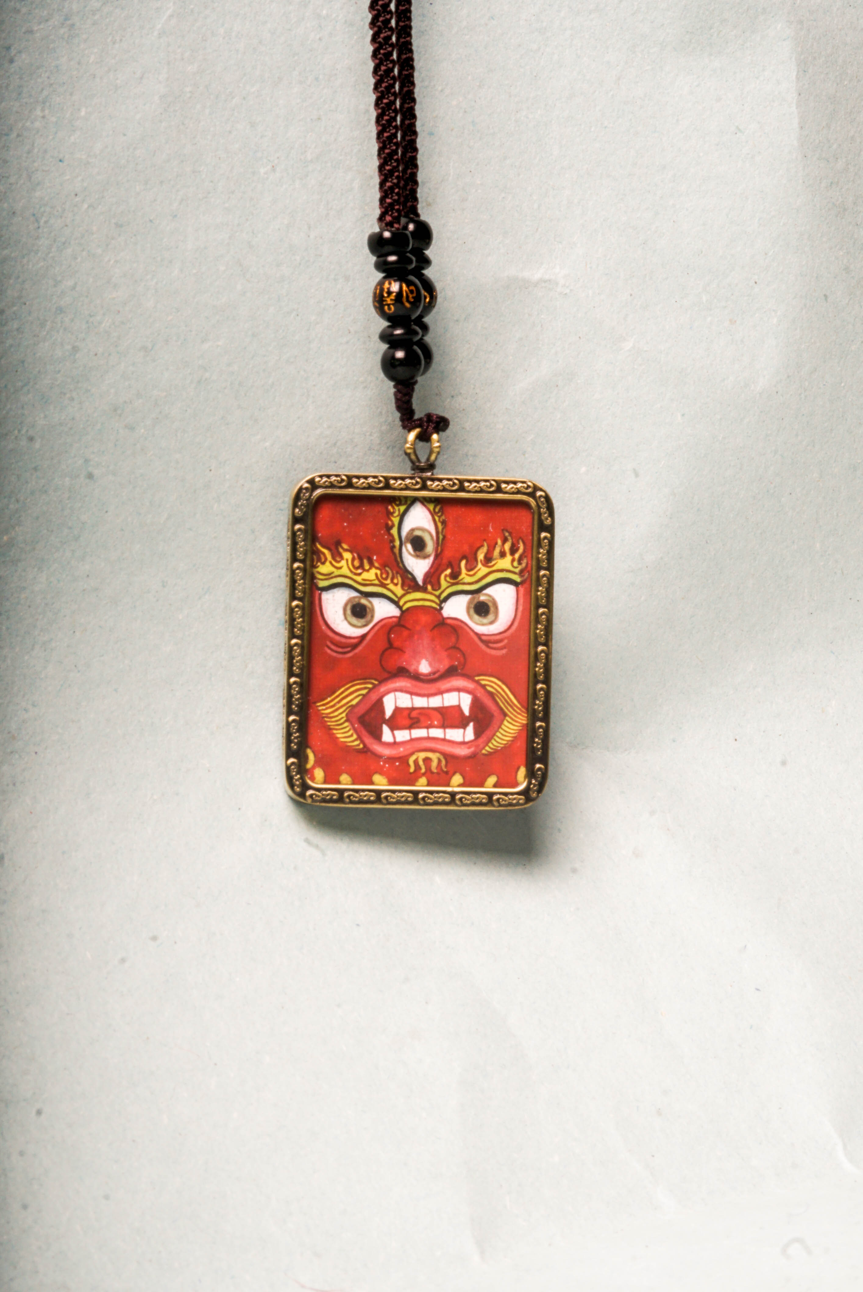 This genuine Mahakala Ghau Thangka embodies fierce protection and transformative power, hand-painted with natural mineral pigments to reflect his role as a Dharma guardian. A portable shrine and spiritual talisman, it supports meditation, wards off negativity, and strengthens your spiritual practice.