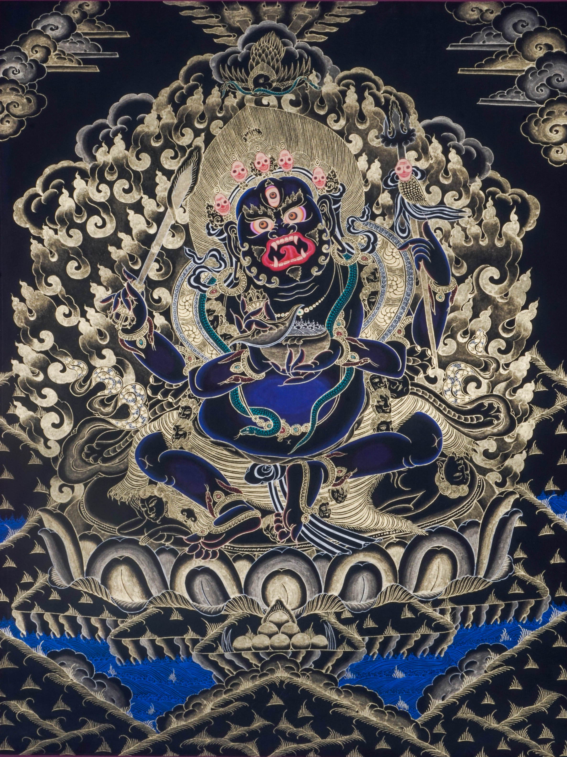 The 4 hand Mahakala Thangka Painting captures the fierce protector of Tibetan Buddhism, symbolizing strength, transformation, and the removal of obstacles. Hand-painted with natural pigments and gold accents, this powerful artwork brings protection, focus, and deep spiritual energy to any sacred space.