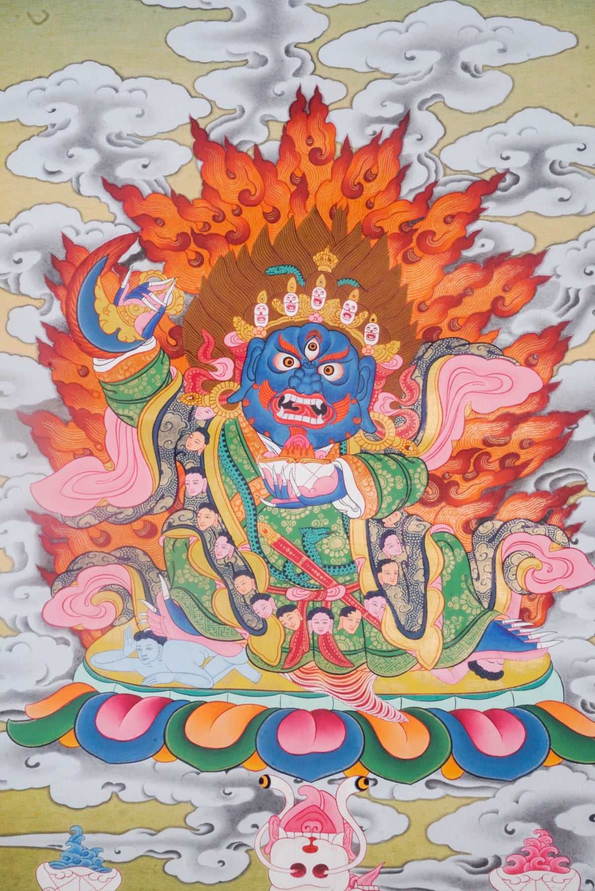 Mahakala is a fierce protector in Tibetan Buddhism, known for removing obstacles and safeguarding the Dharma. This vibrant Thangka painting captures his powerful presence with traditional artistry, making it a striking focal point for meditation and spiritual protection.