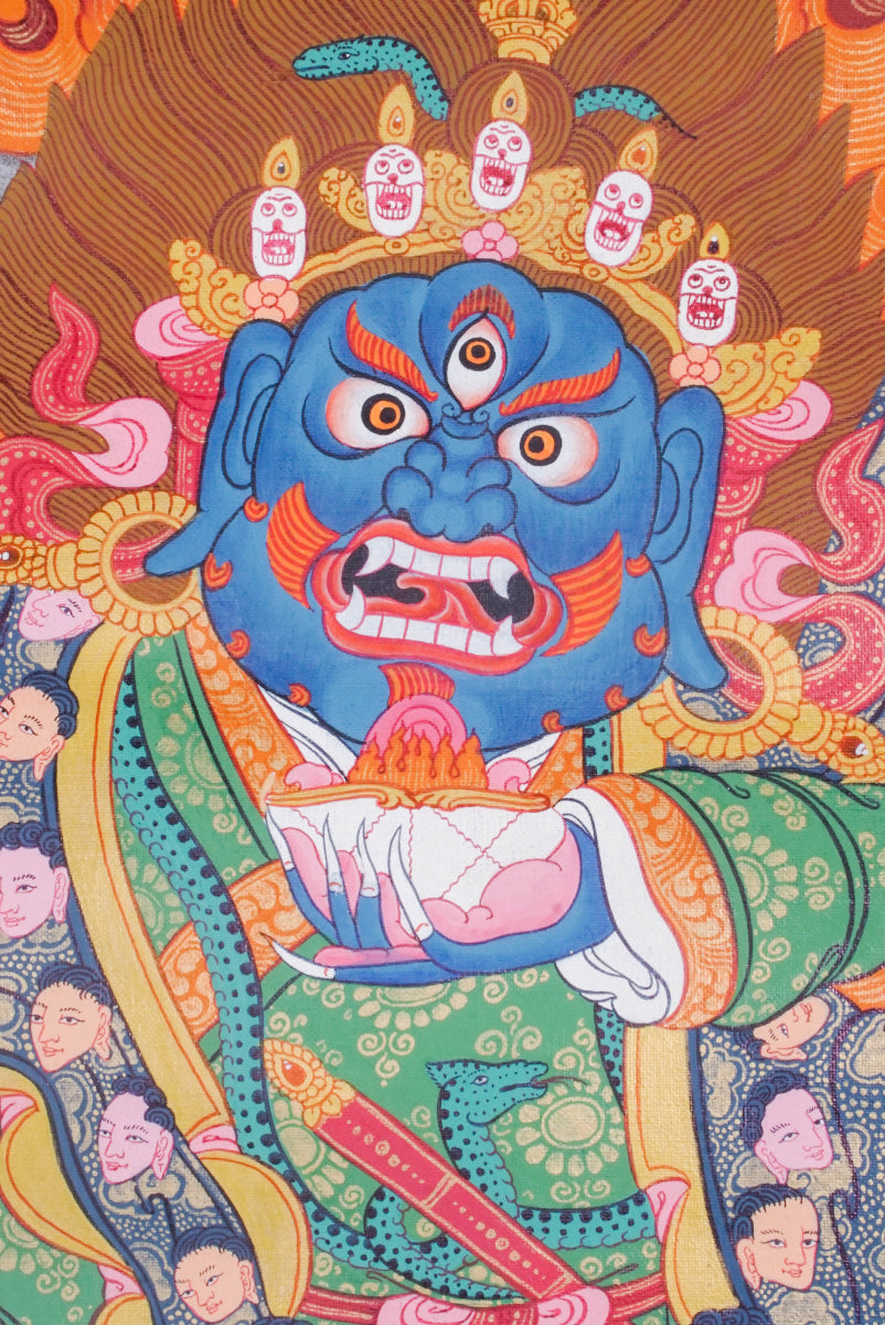 Mahakala is a fierce protector in Tibetan Buddhism, known for removing obstacles and safeguarding the Dharma. This vibrant Thangka painting captures his powerful presence with traditional artistry, making it a striking focal point for meditation and spiritual protection.
