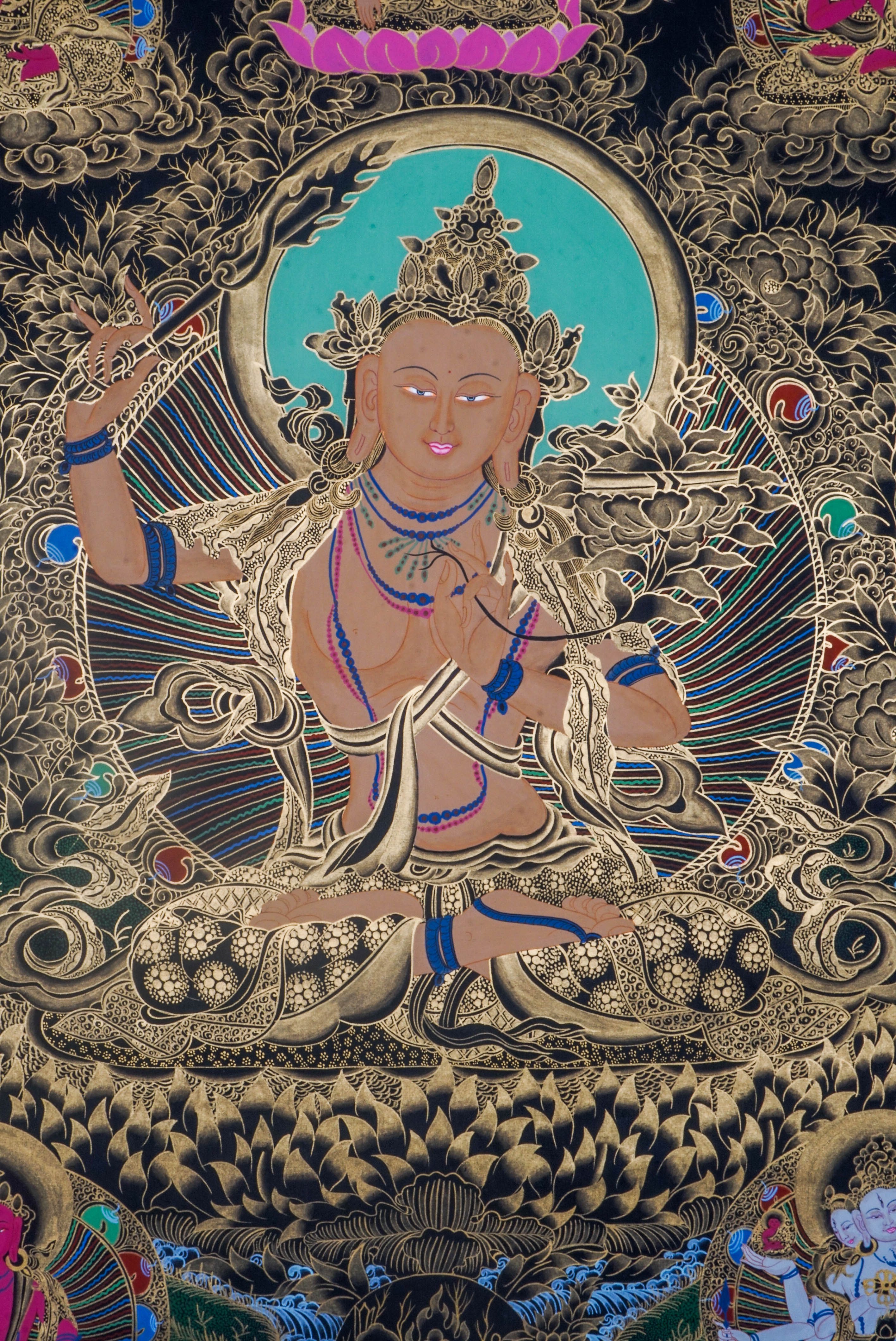 Manjushri Thangka depicts the Bodhisattva of Wisdom, holding a sword to cut ignorance and a scripture symbolizing Dharma knowledge. Hand-painted by skilled Tibetan artists using natural pigments, this sacred artwork inspires clarity, insight, and spiritual growth.