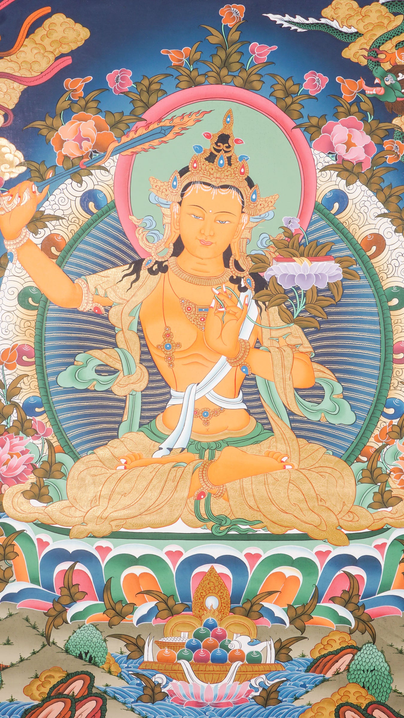 The Manjushree Thangka depicting the Bodhisattva of Wisdom seated on a lotus, holding a sword and a scripture.