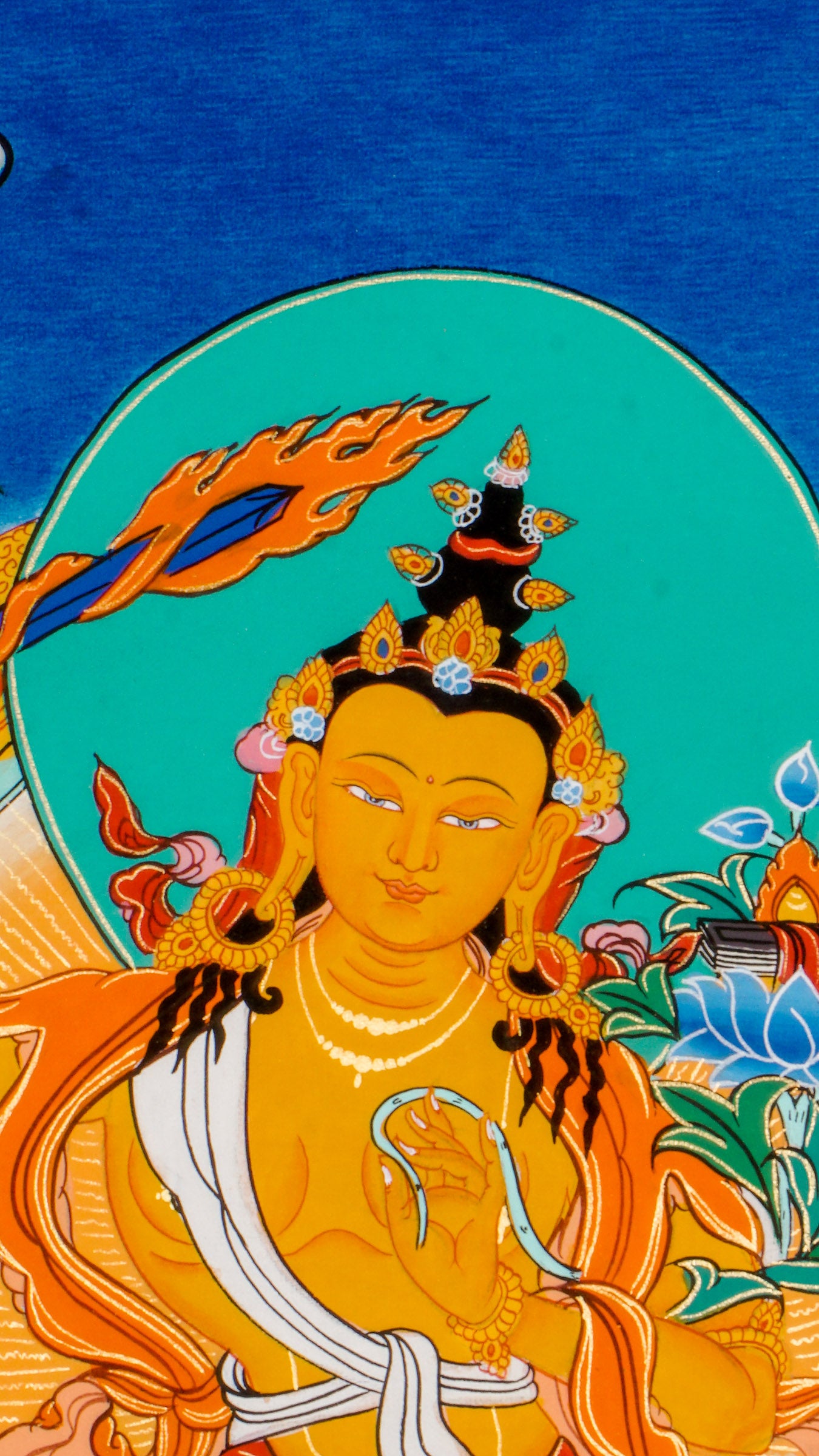 Manjushree Thangka - Hand-painted beautiful thangka art showcasing Manjushree holding a flaming sword using 24k gold and natural pigments in Nepal.