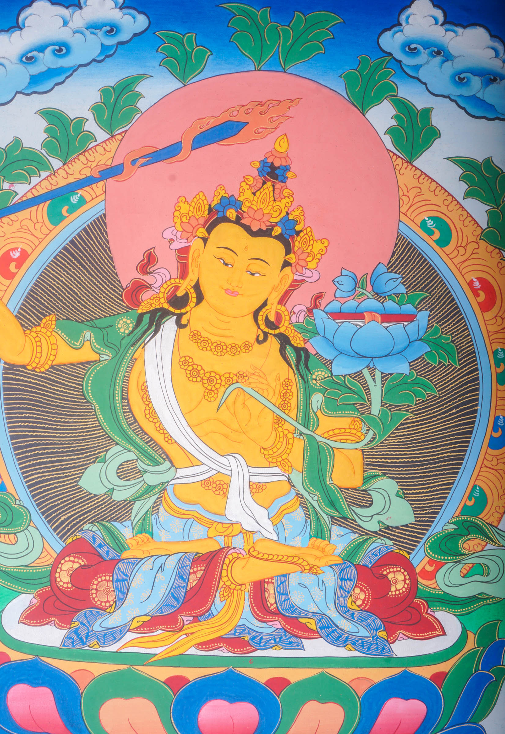 Handmade Thangka Painting of Manjushri embodies the essence of wisdom that dispels the darkness of ignorance